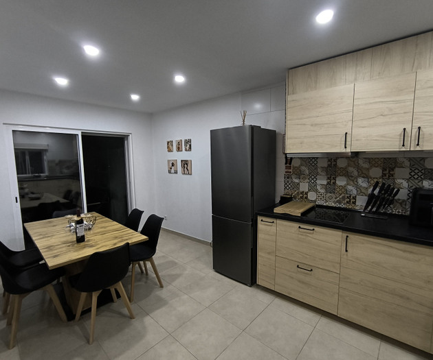 Kitchen and dining area at night