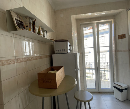 Sunny room with shared terrace in Alfama