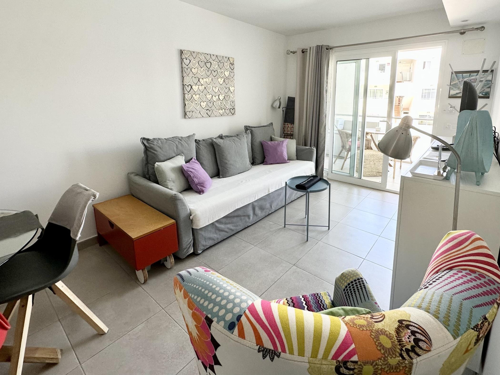 Bright living room with sofa balcony