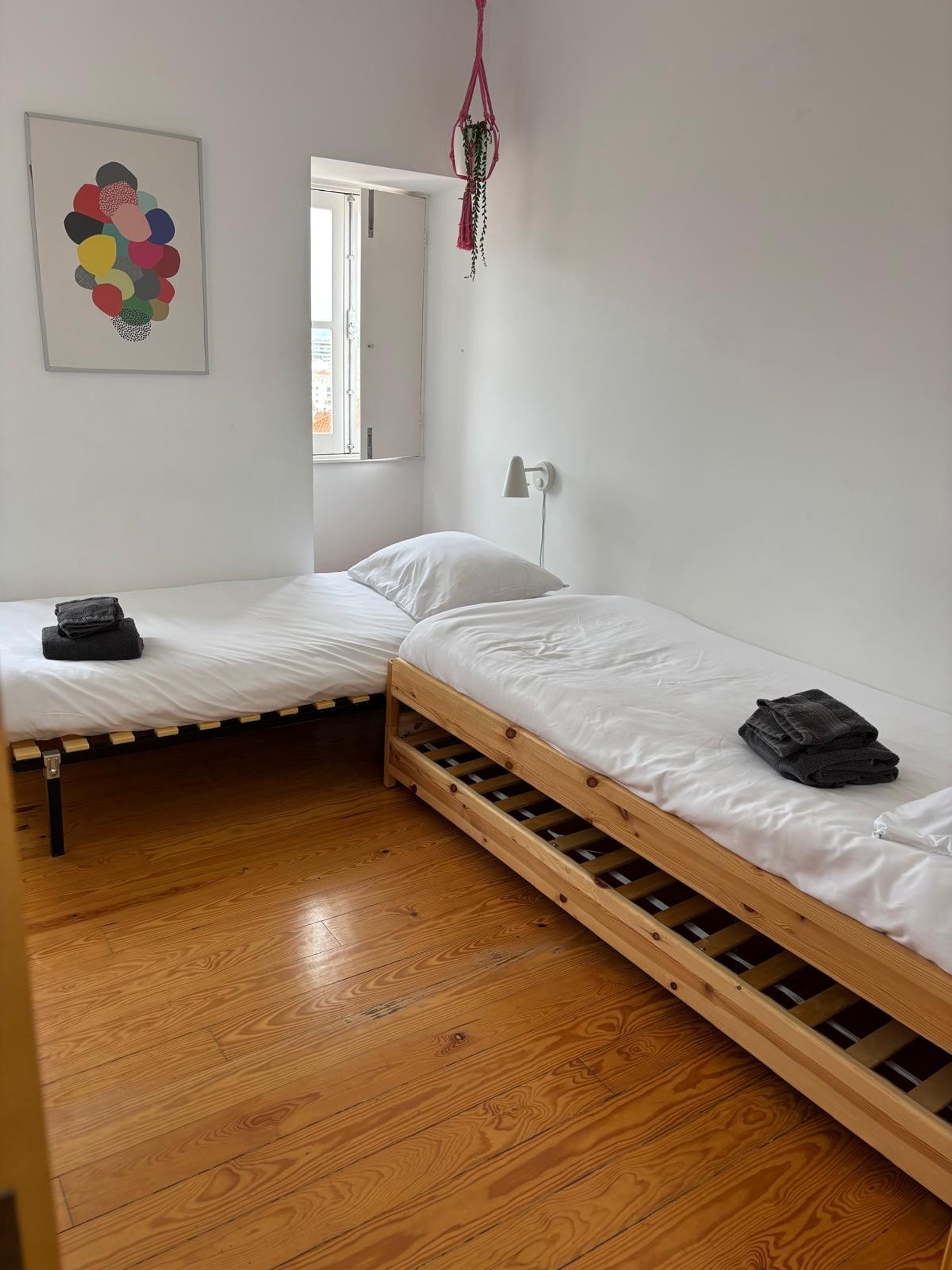 Twin bedroom with wooden floors
