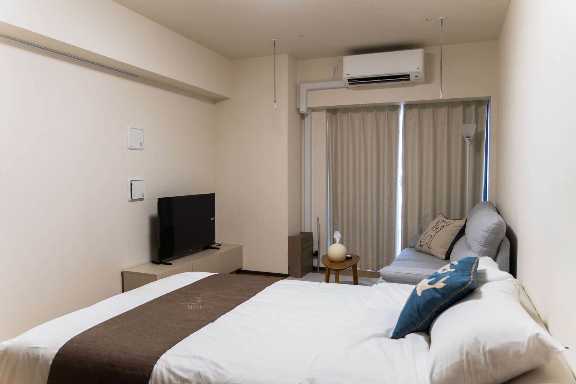 Bedroom with TV and window