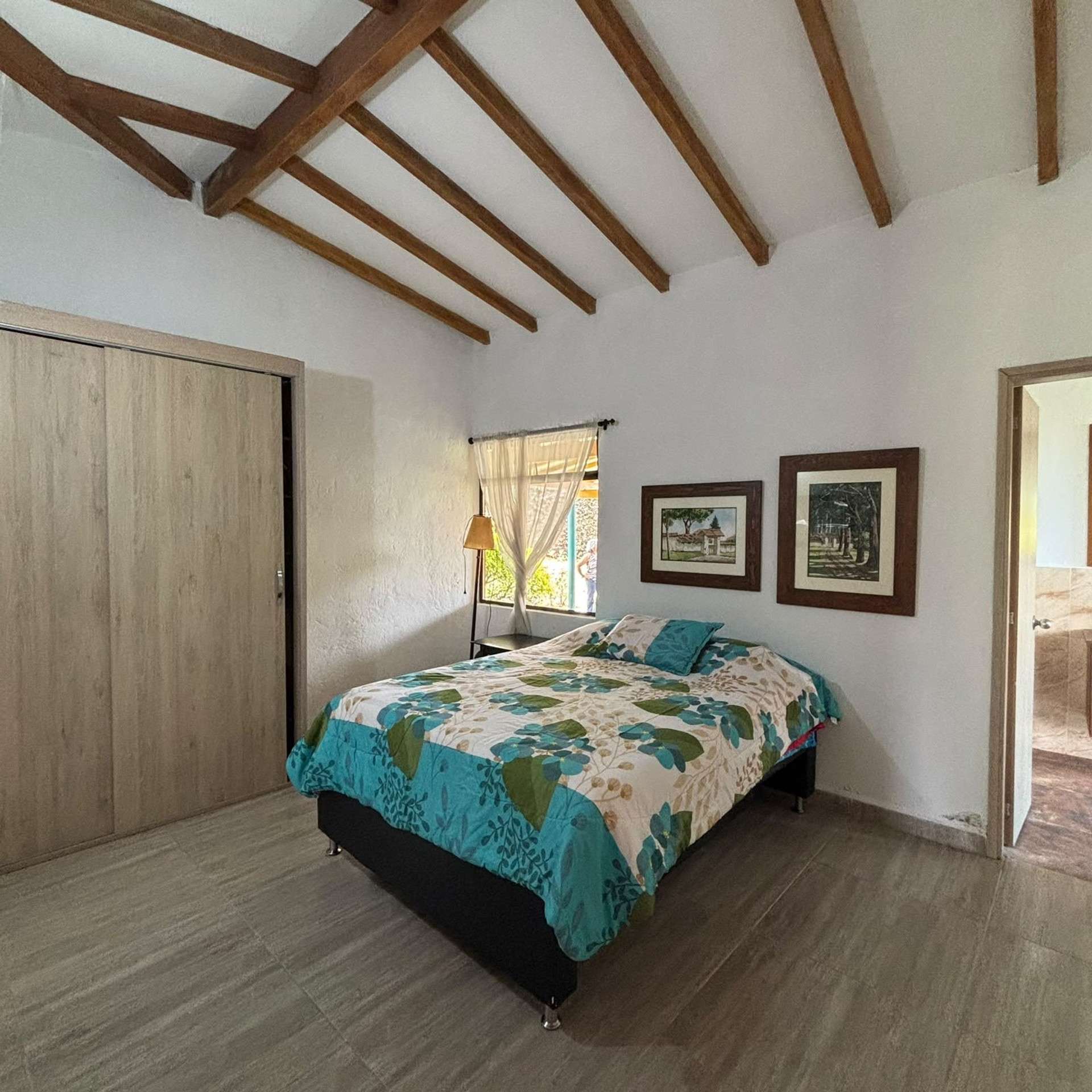 Bedroom with double bed, wardrobe