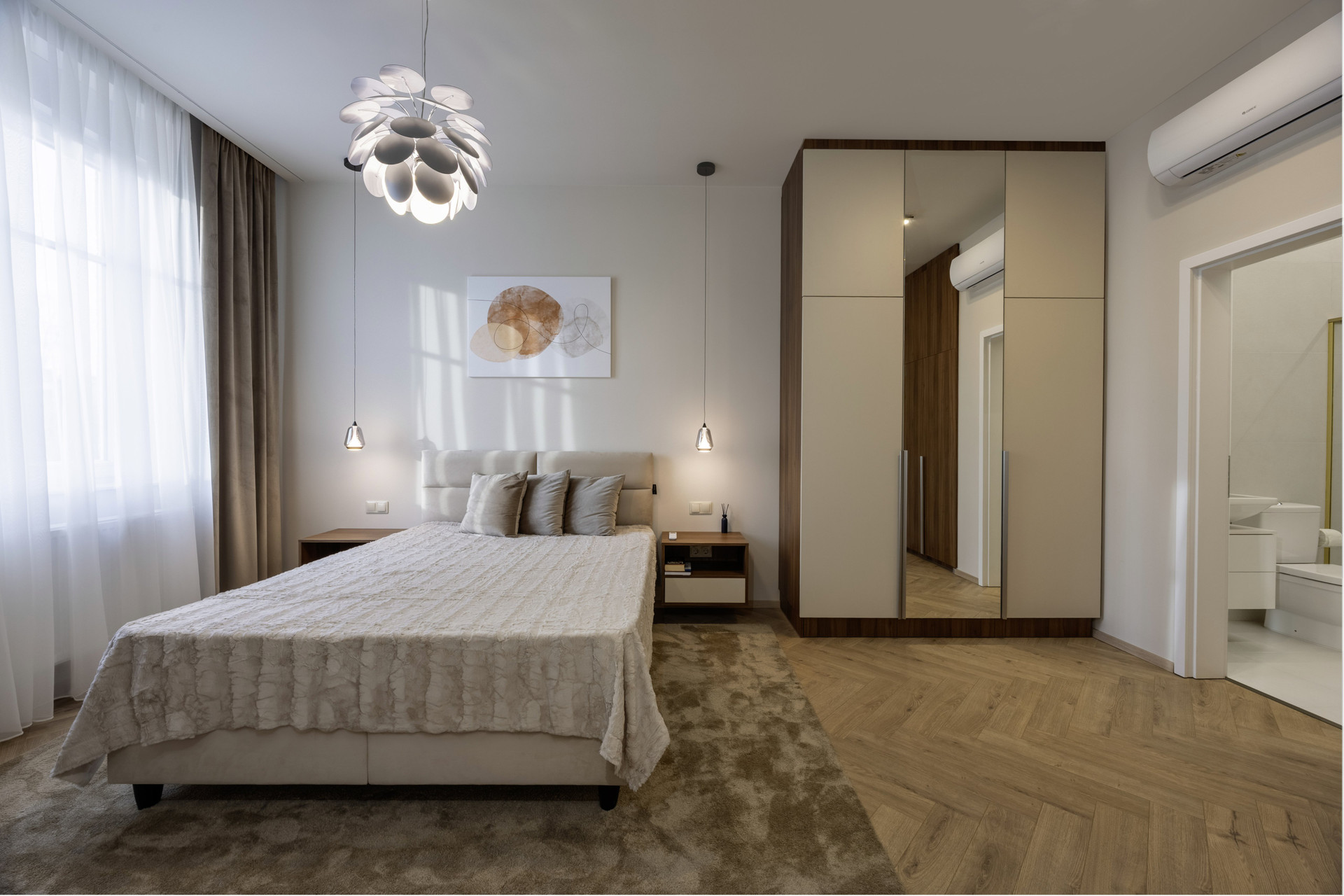 Spacious bedroom with mirrored wardrobe