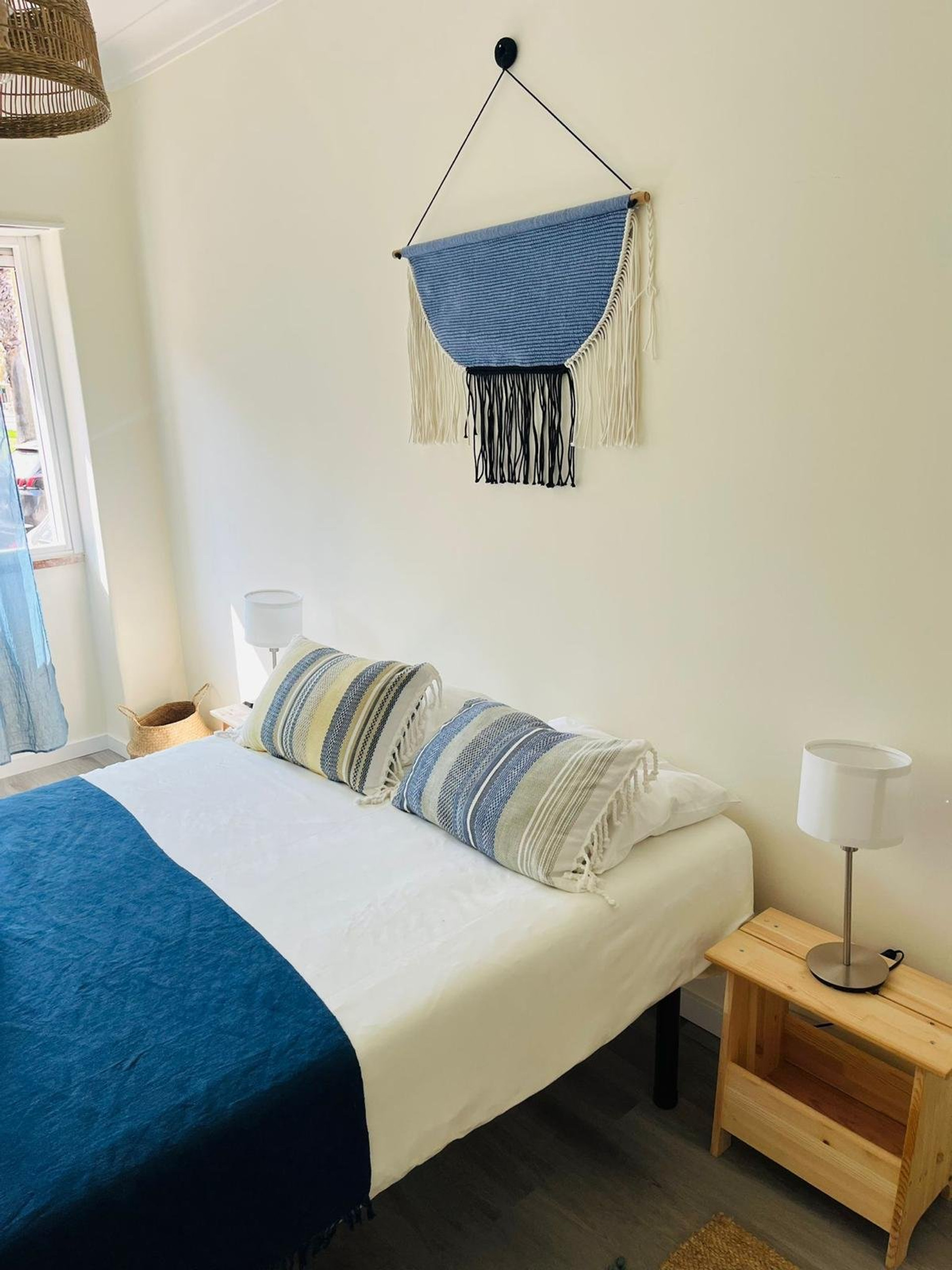 Bedroom with blue bedding boho decor