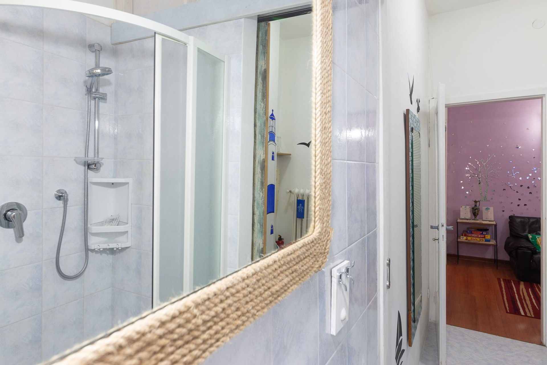 Bathroom with shower and mirror