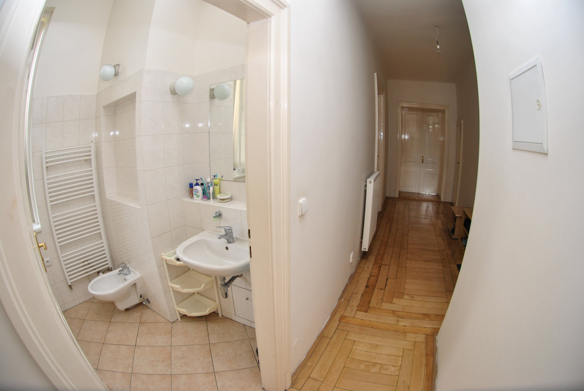 Bathroom with sink and hallway view