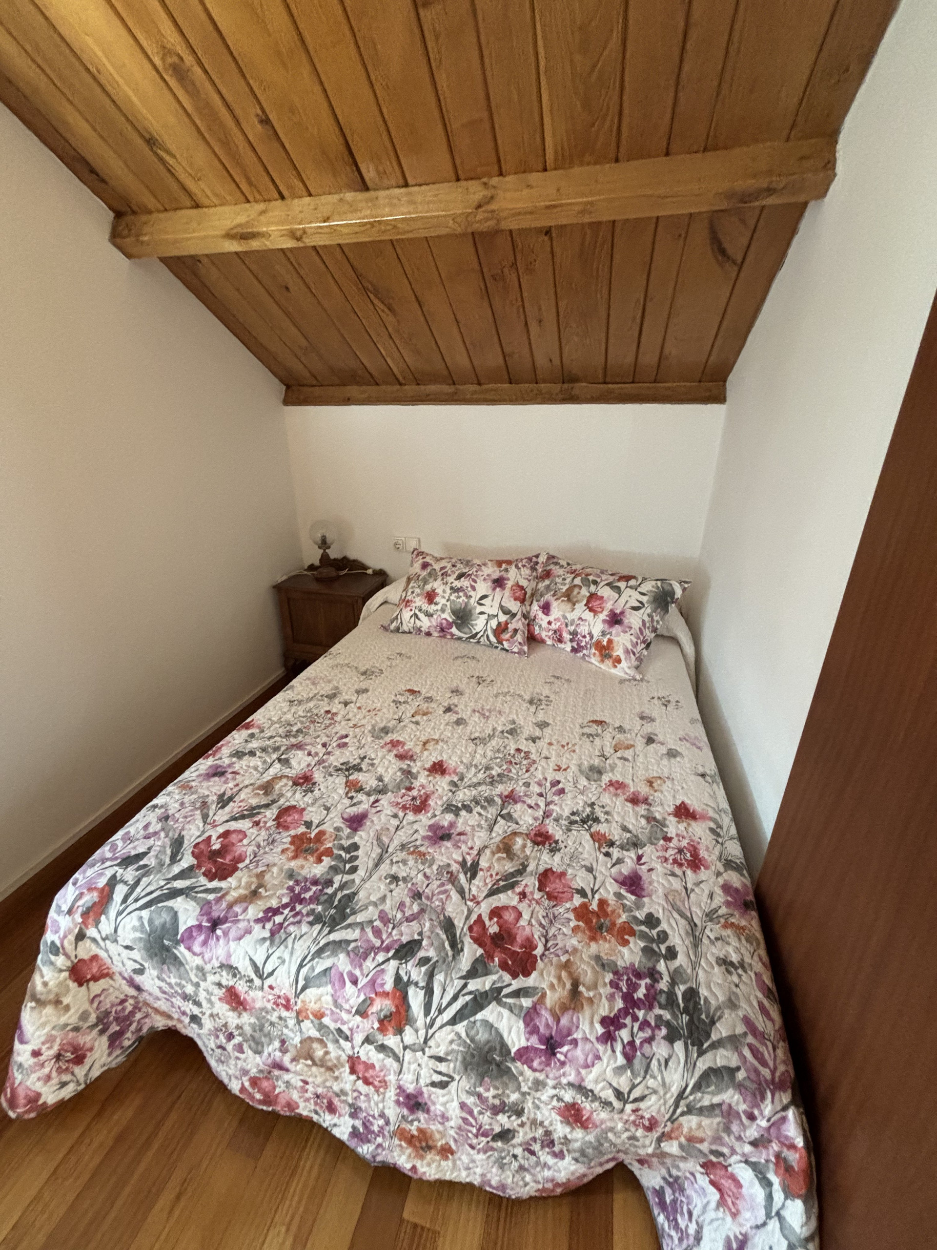 Bedroom with floral bedspread