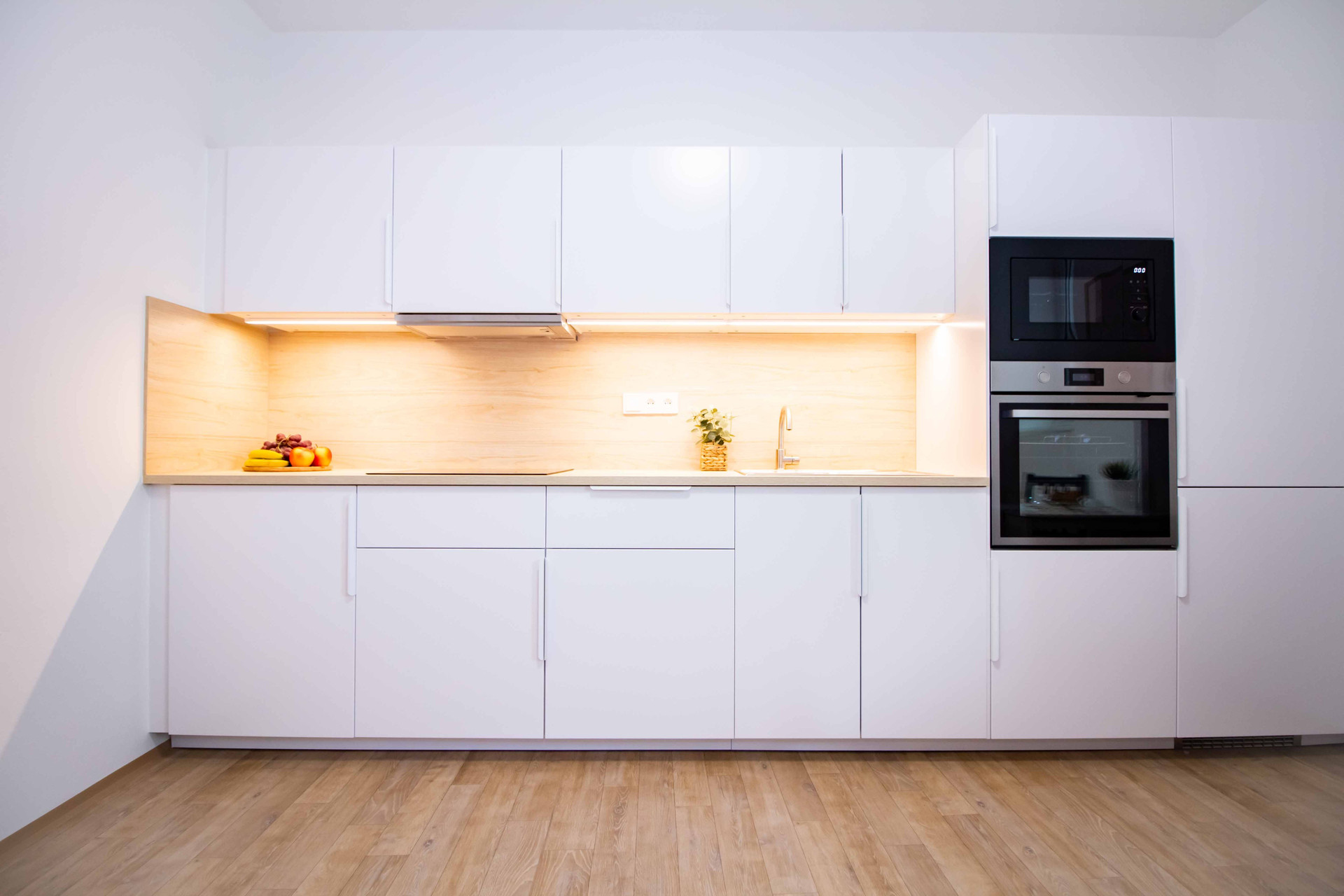 Full white kitchen with oven microwave