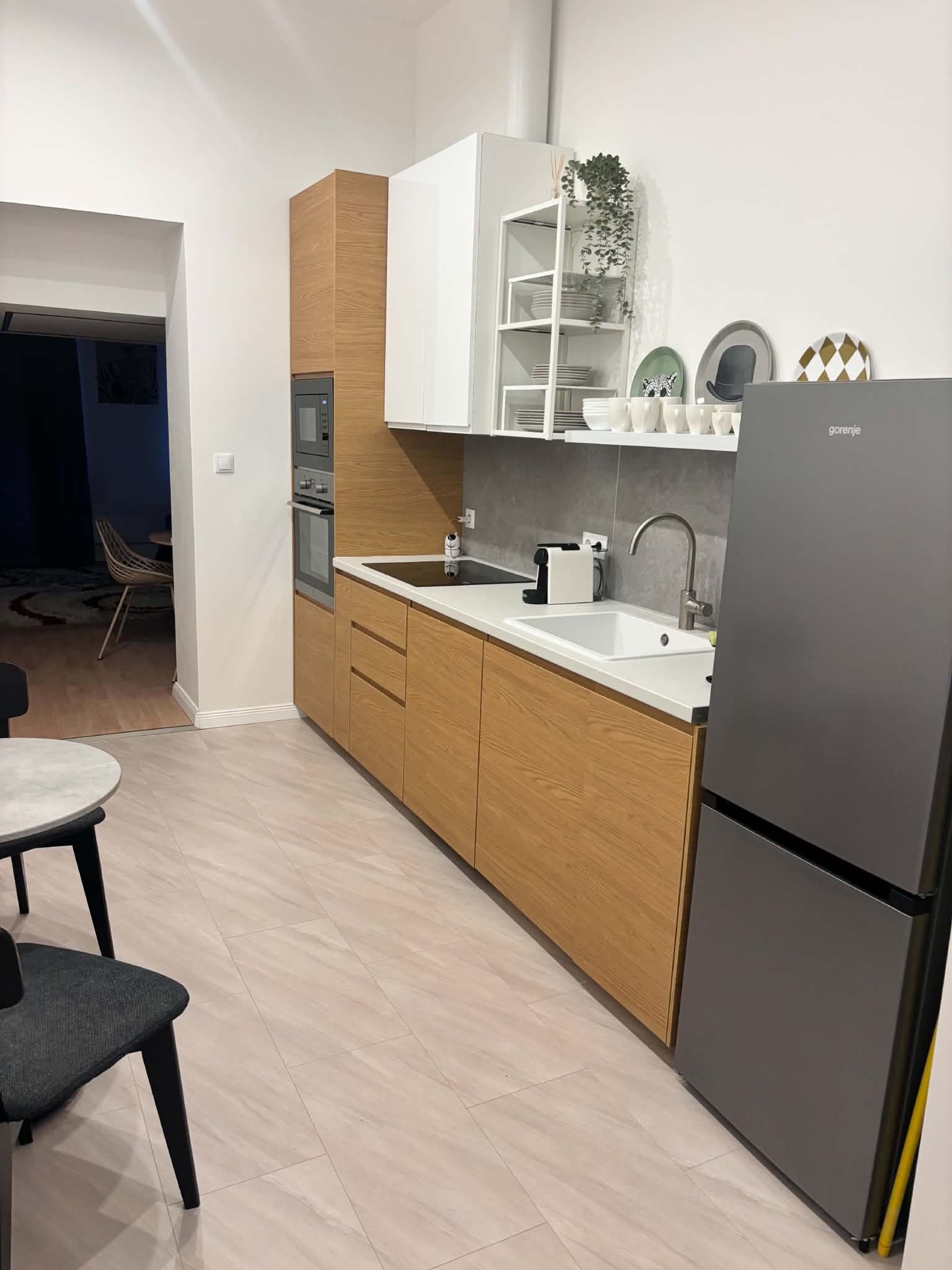 Kitchen with appliances and fridge