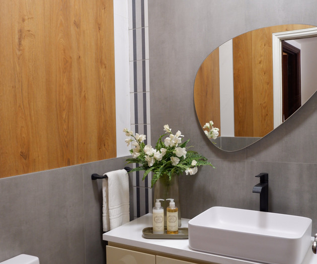 Guest toilet with grey tiles