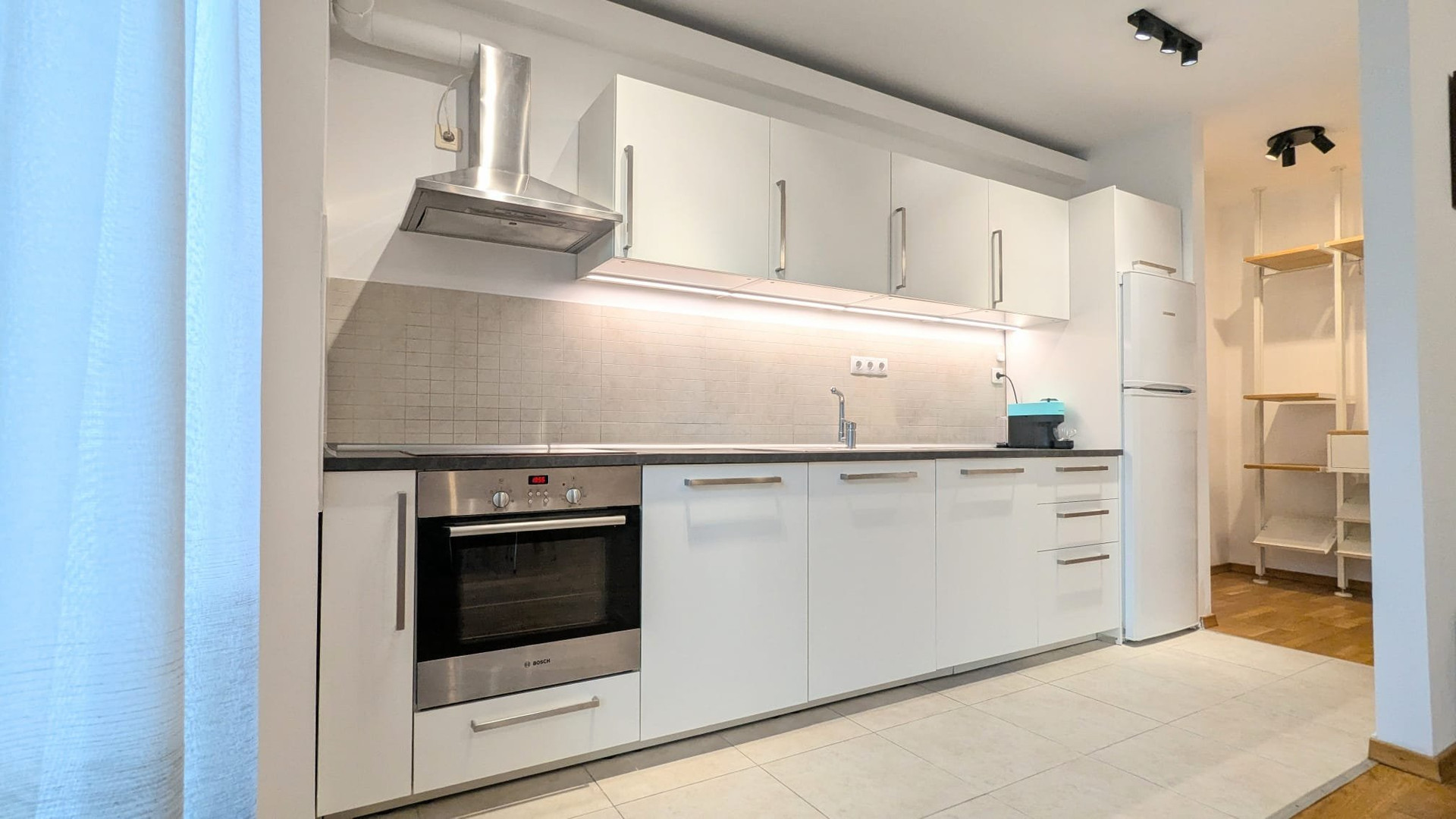 Modern white kitchen with oven