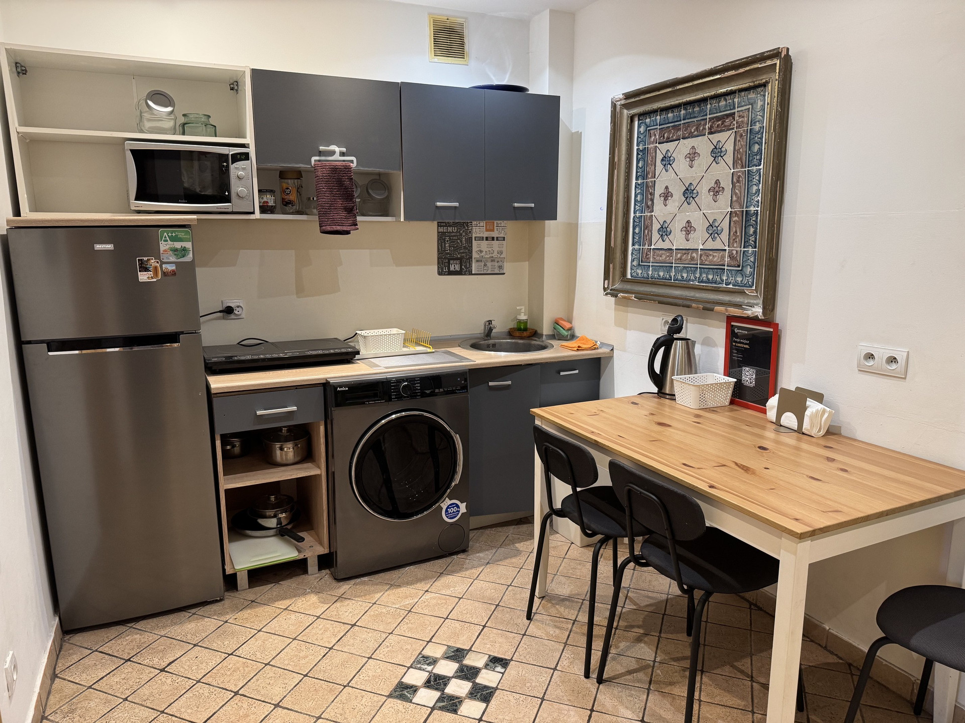 Kitchen with appliances and dining table