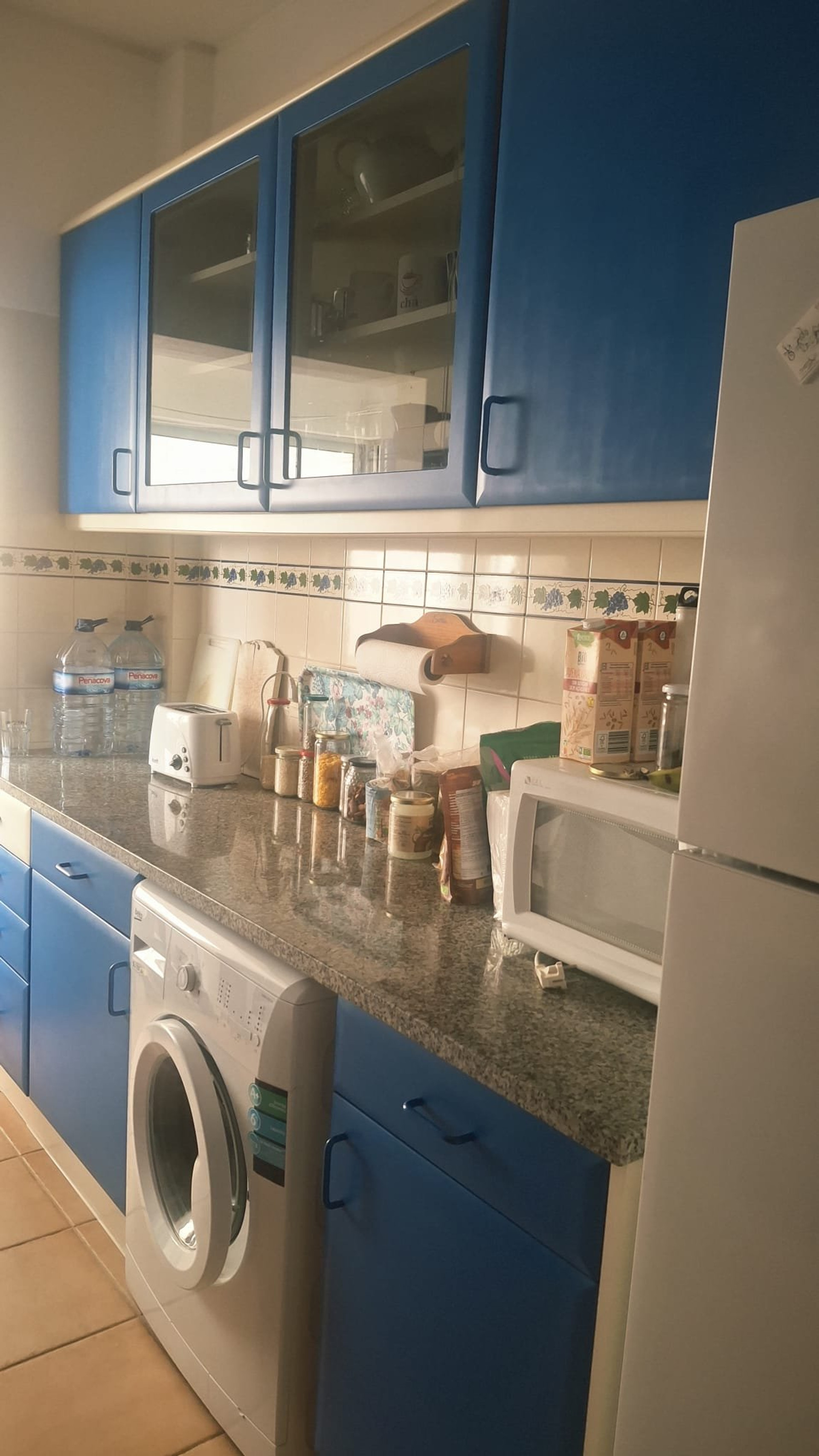 Kitchen with blue cabinets