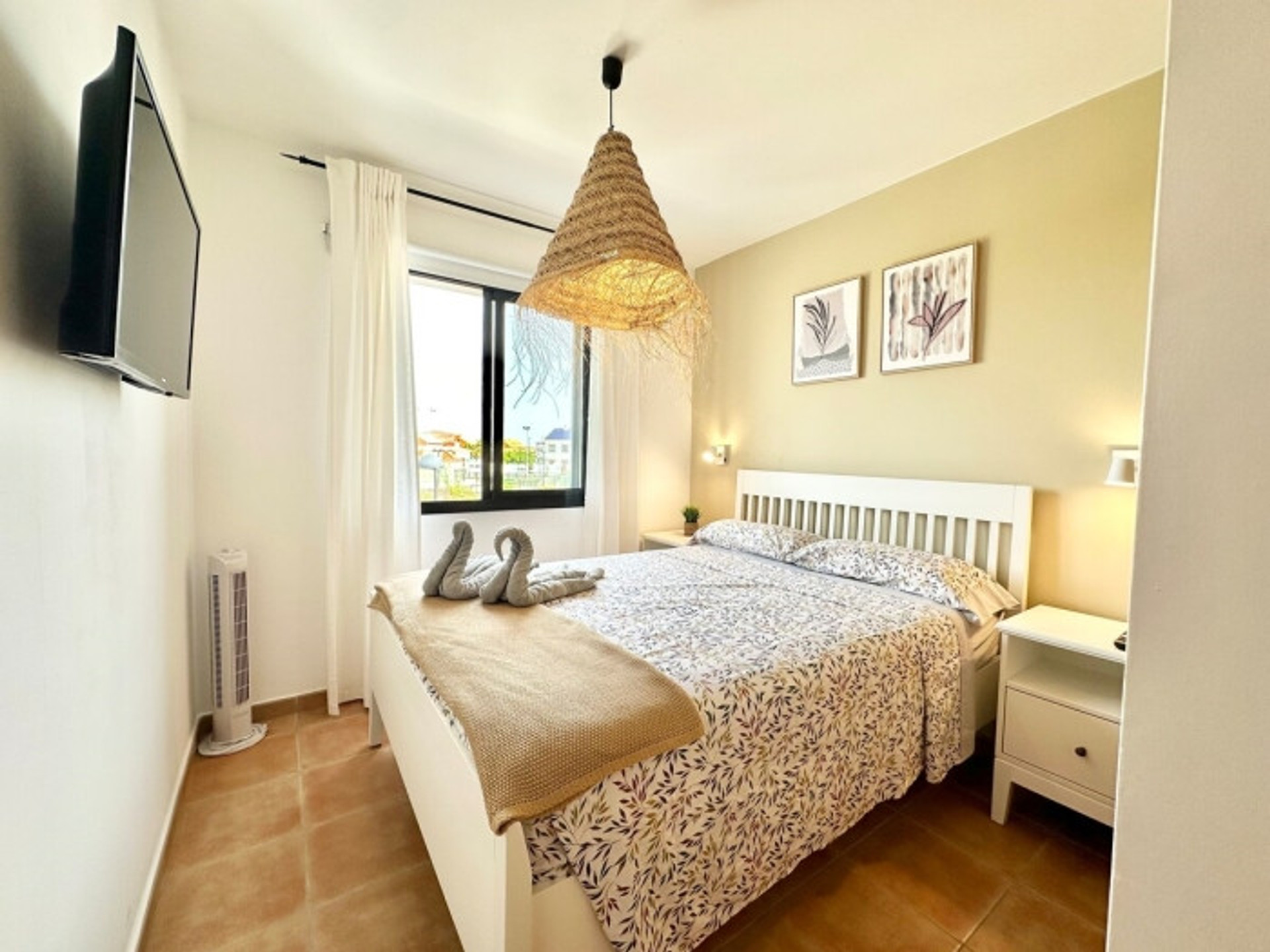 Bright double bedroom with TV