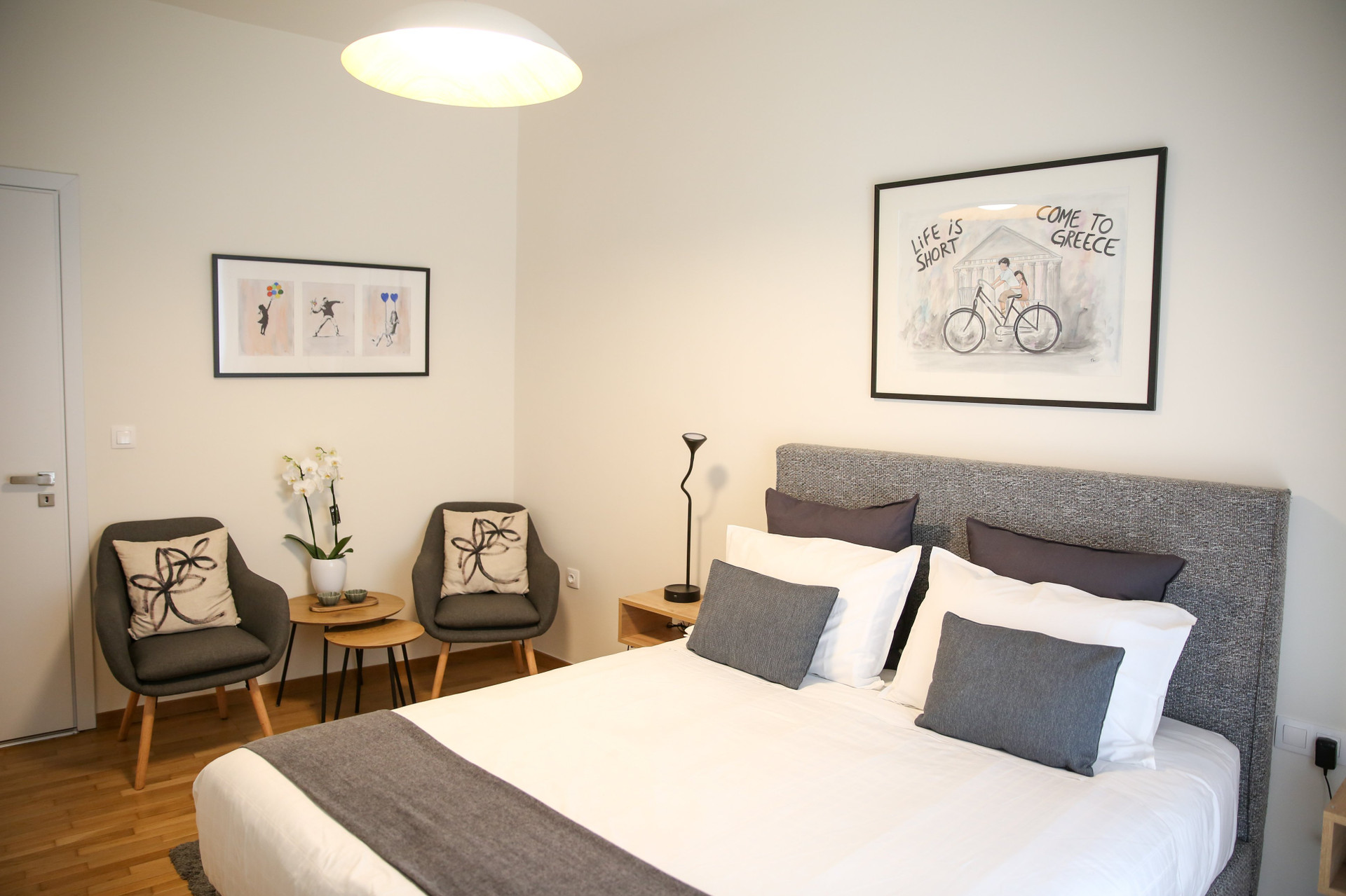 Bedroom with seating and art