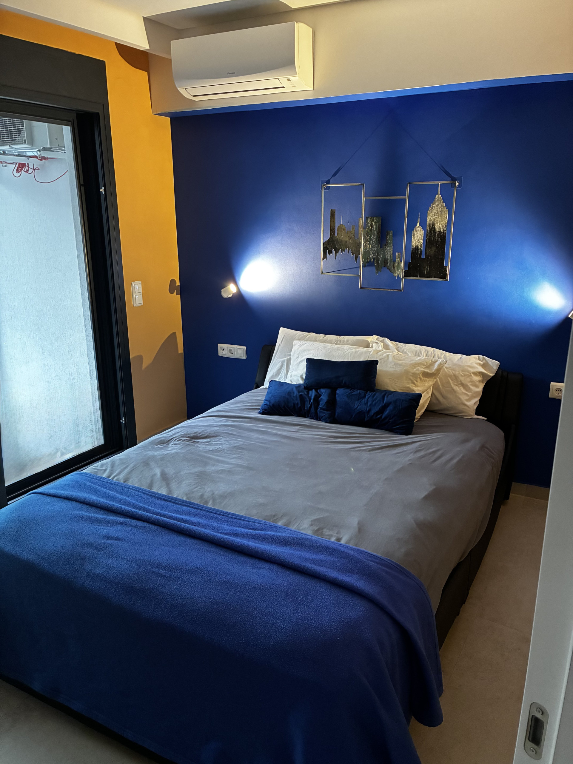 Bedroom with blue accent wall