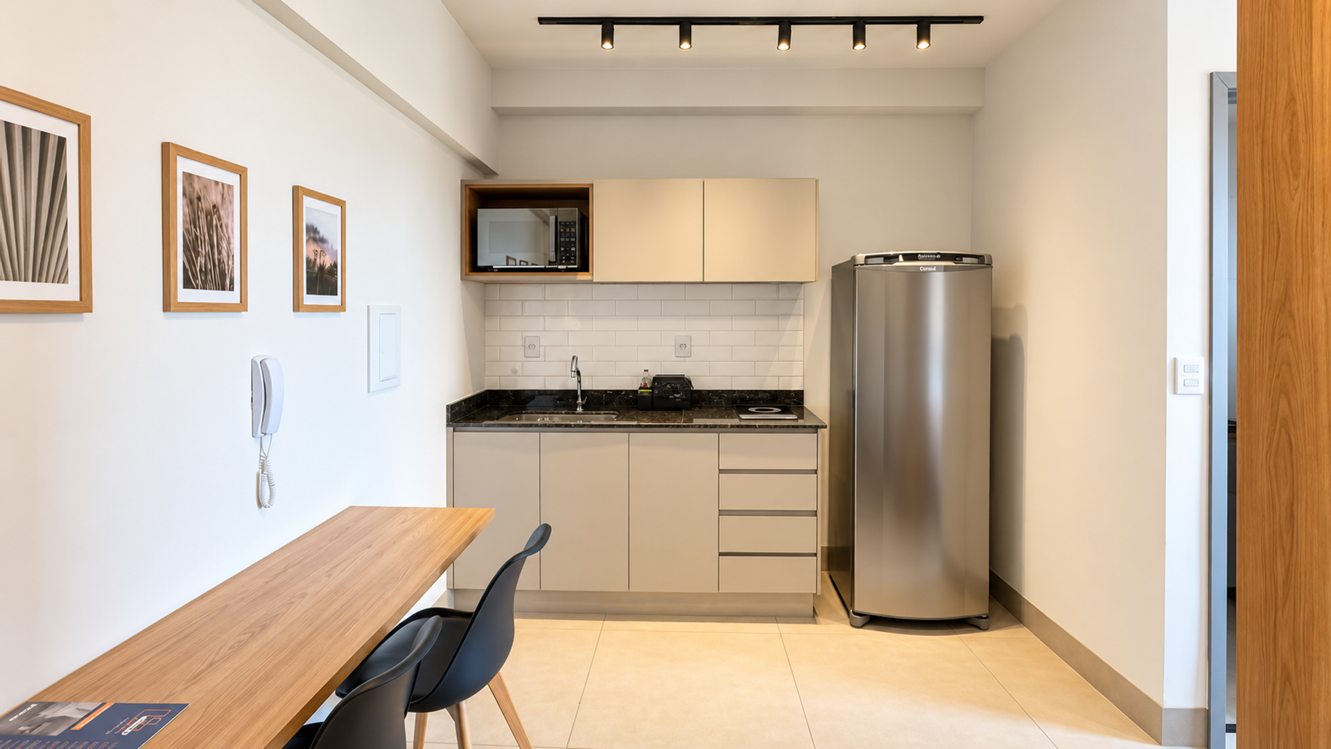 Kitchenette with fridge and desk
