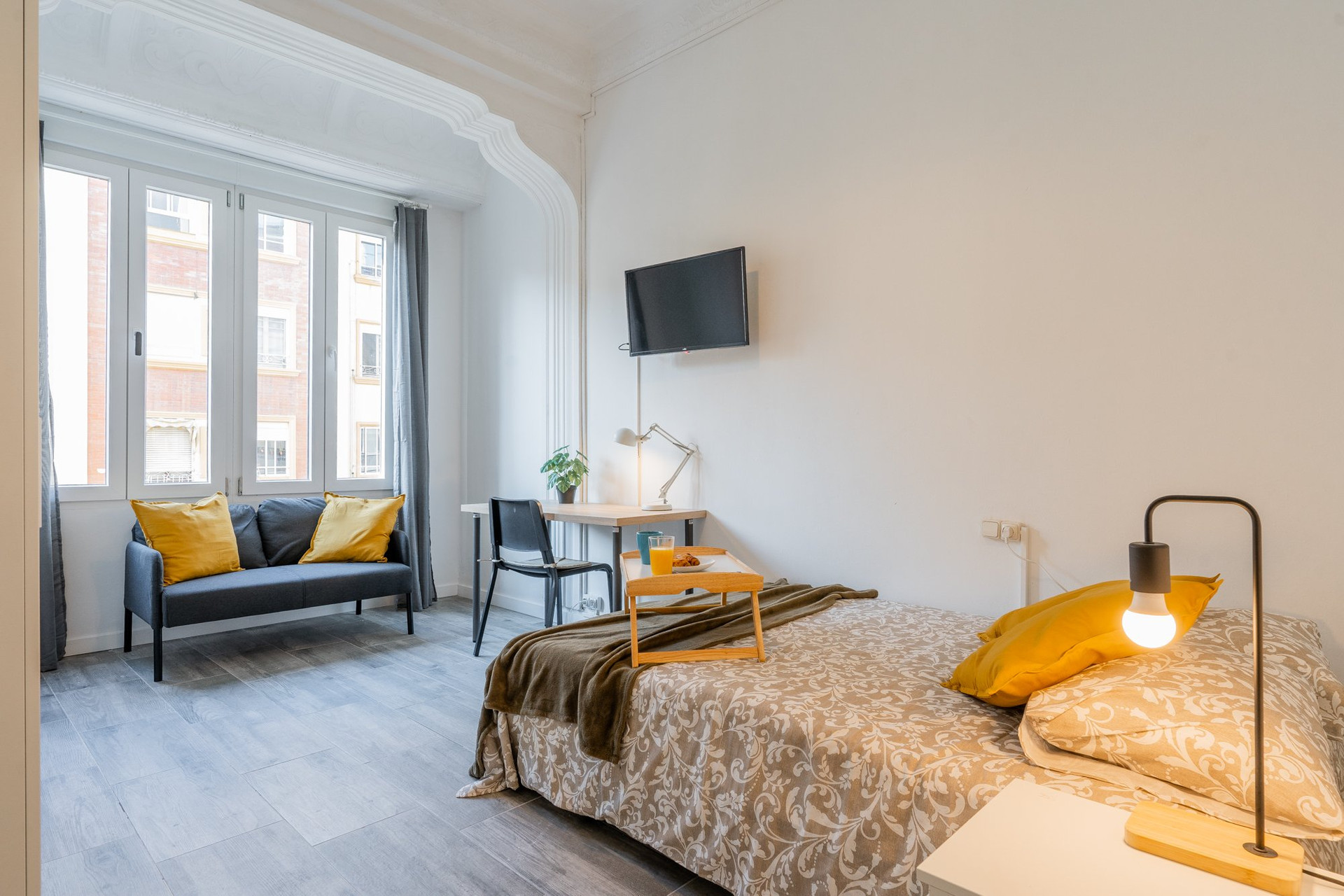 Bright studio with bed and sofa