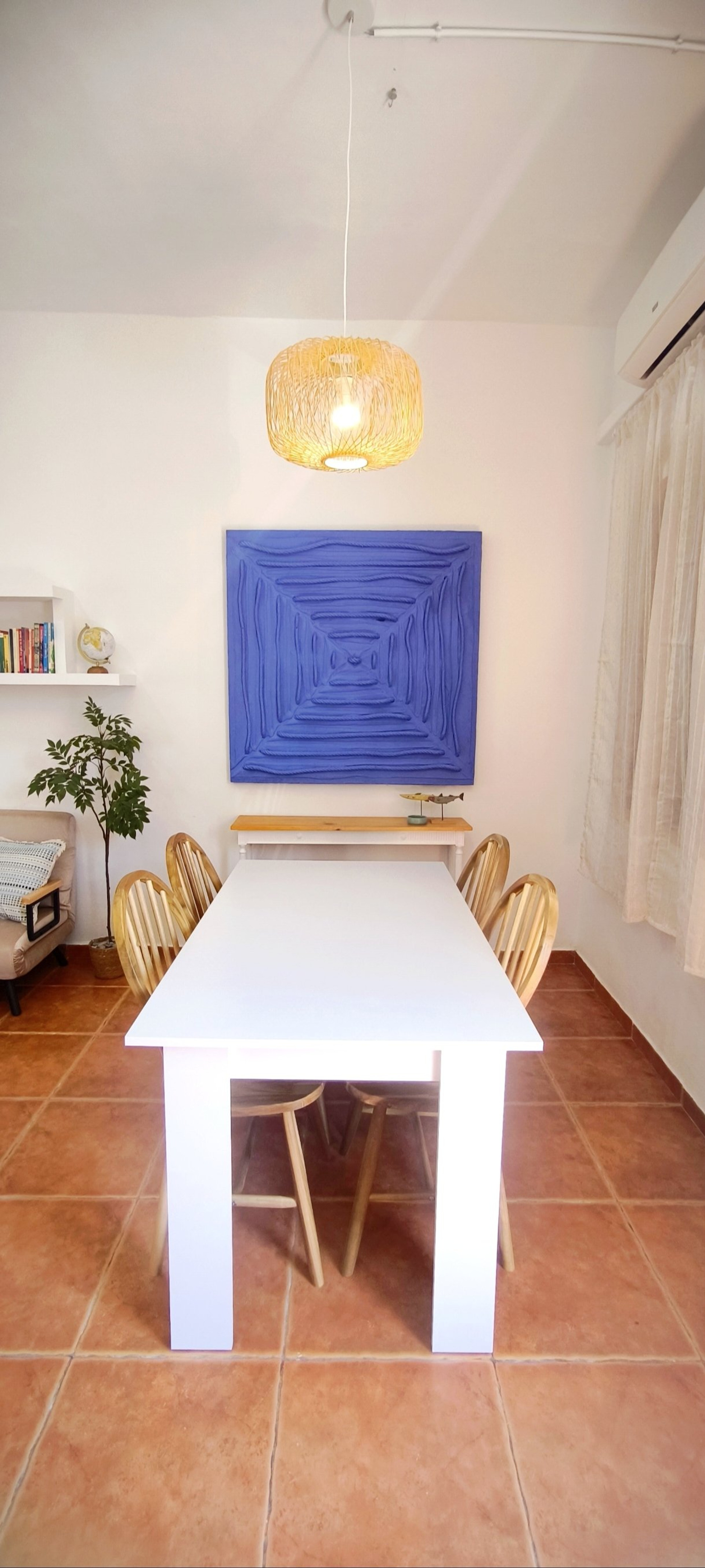 Dining table with blue art
