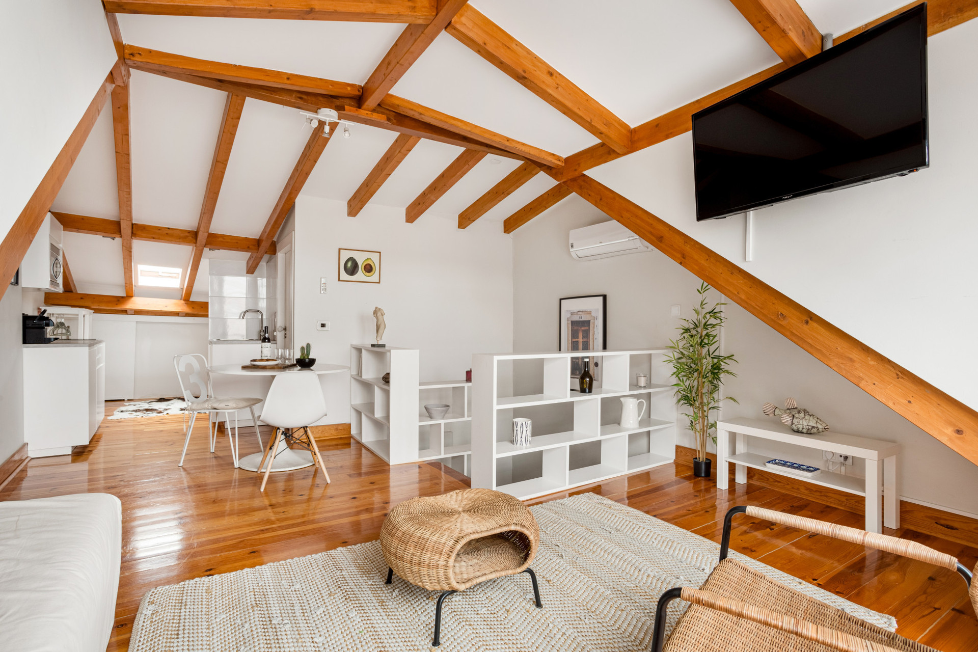 Living Area with Sofa with TV, Dining Table and Kitchenette
