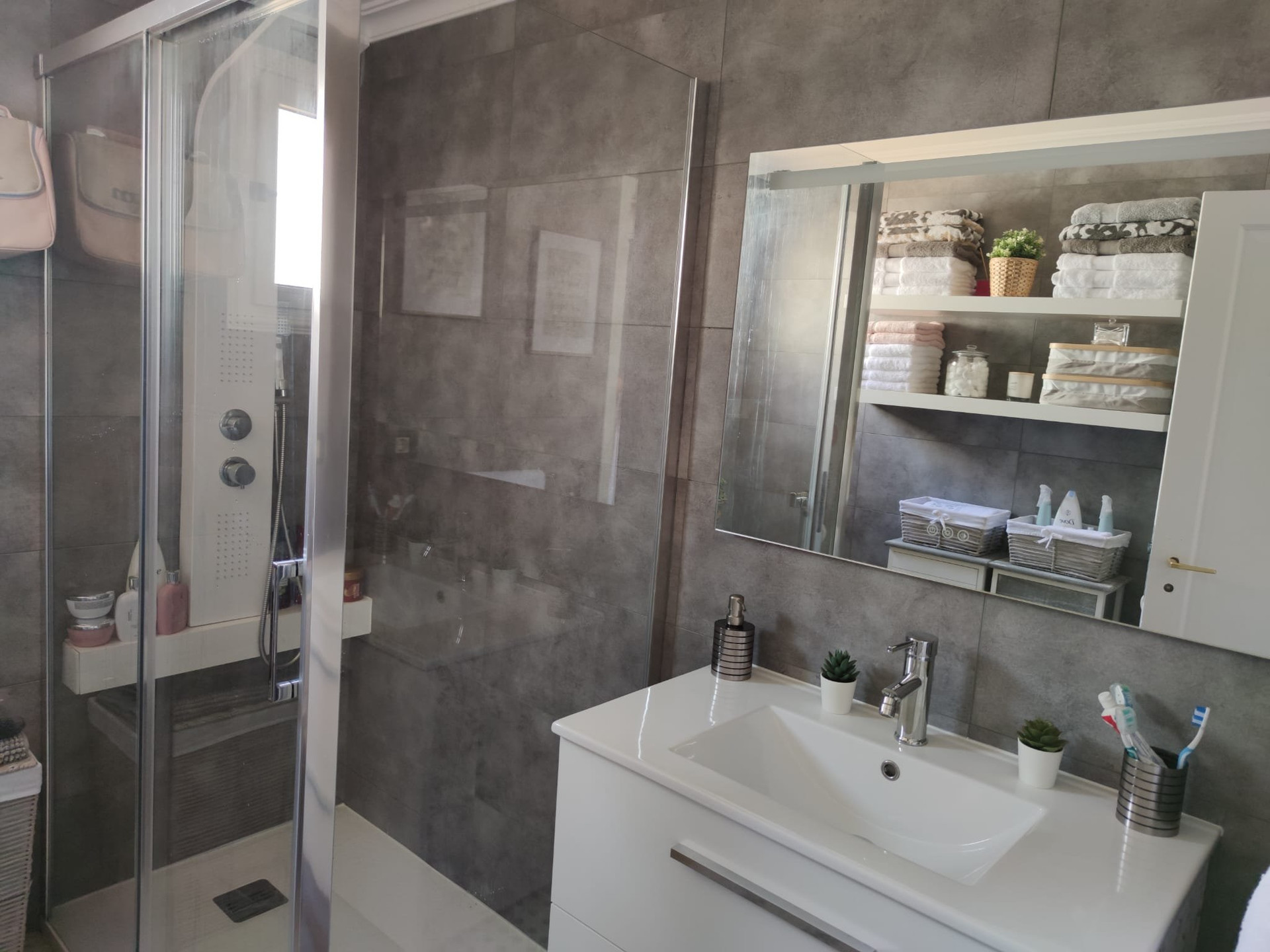Modern bathroom with shower and vanity