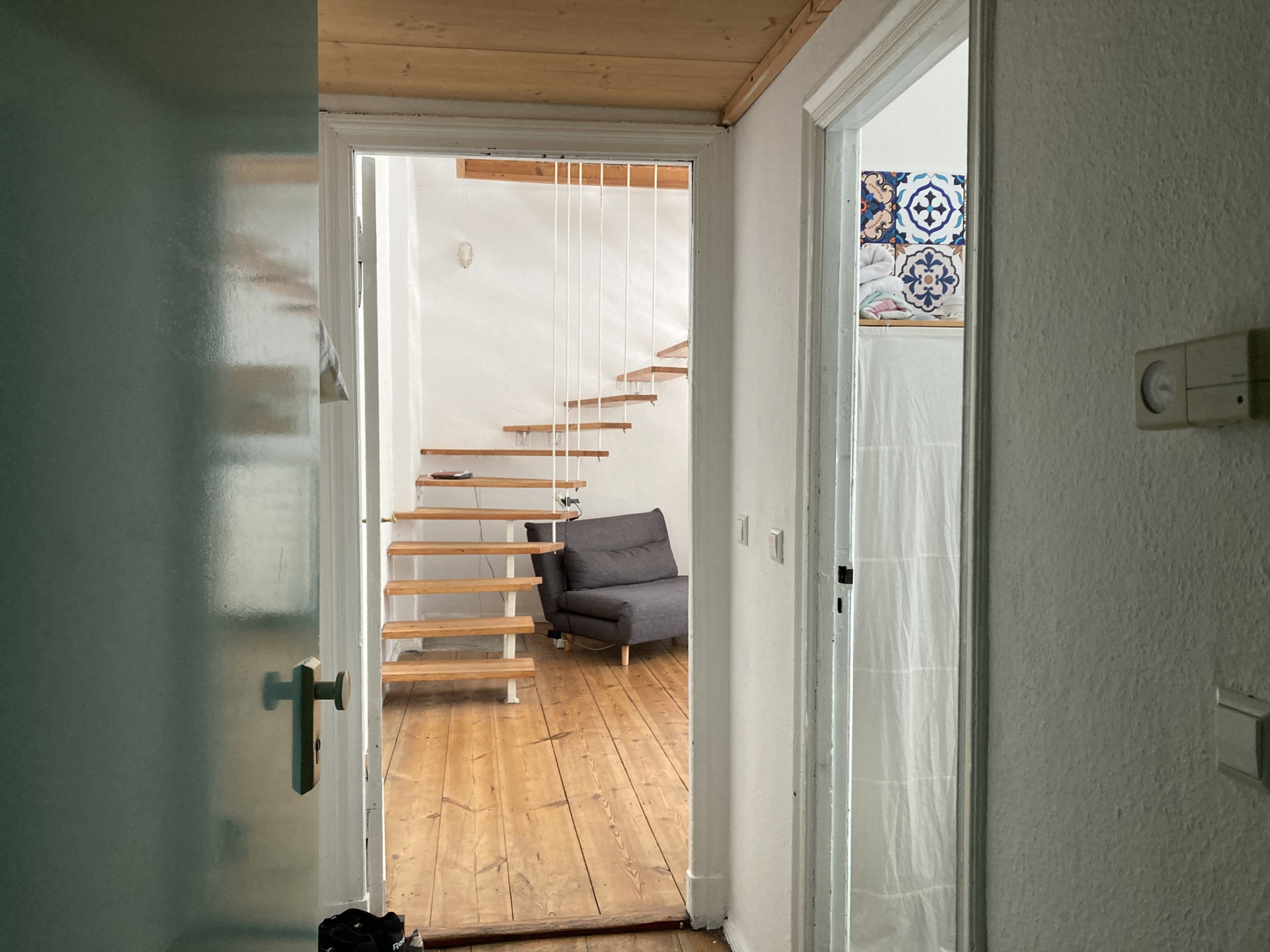 View from the entrance, bedroom ahead, bathroom to the right!
