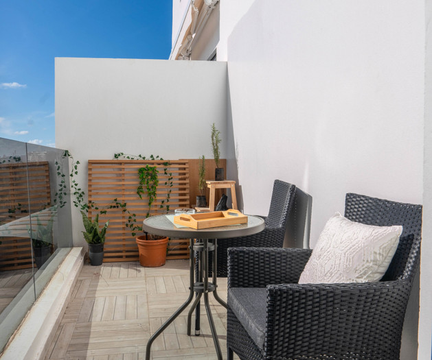 Balcony with bistro table and chairs