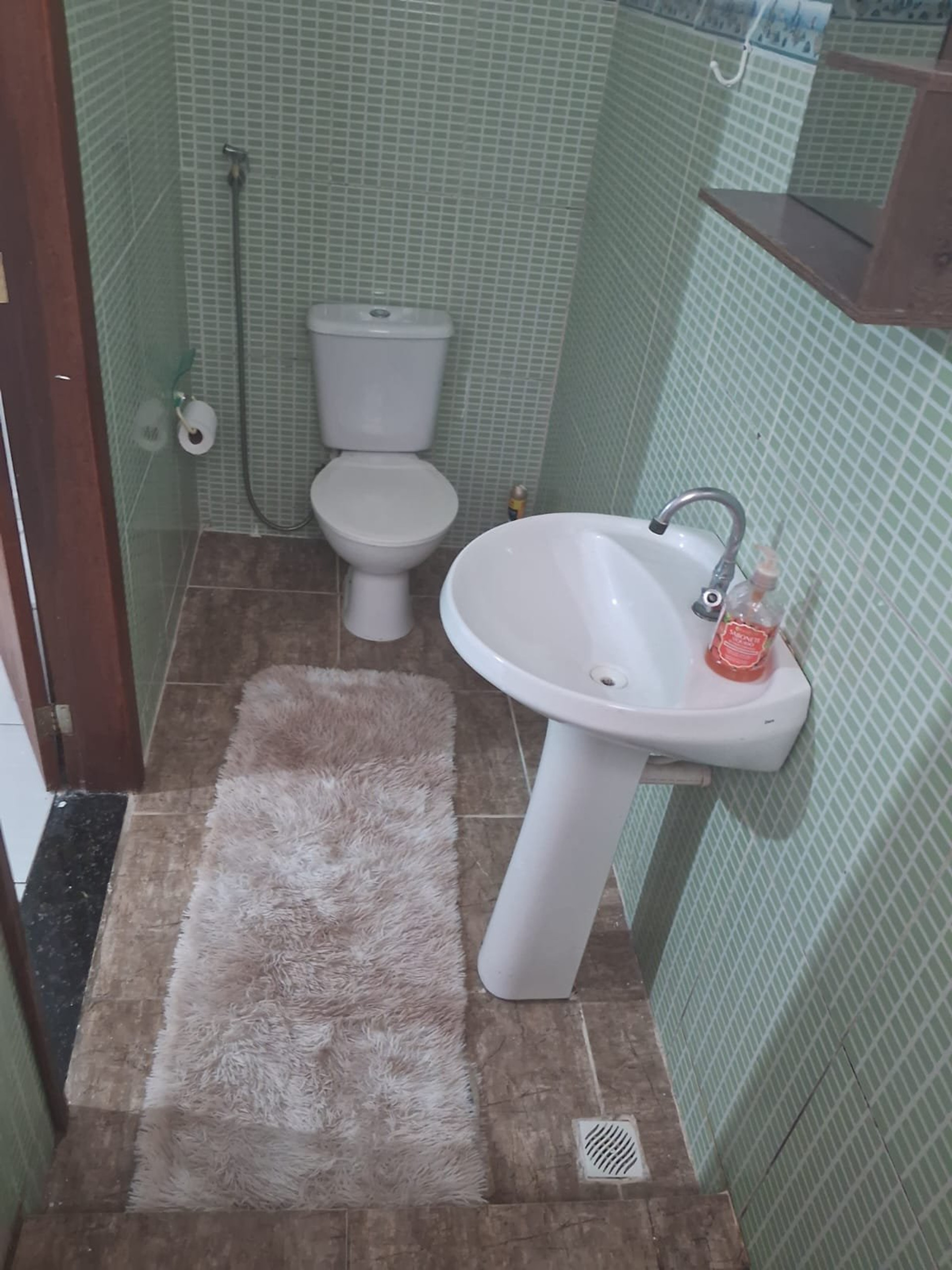 Bathroom with green tiles