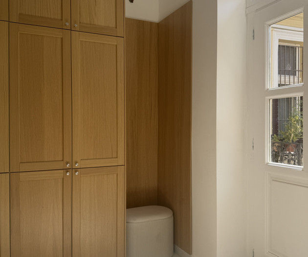 Wardrobe storage above bed