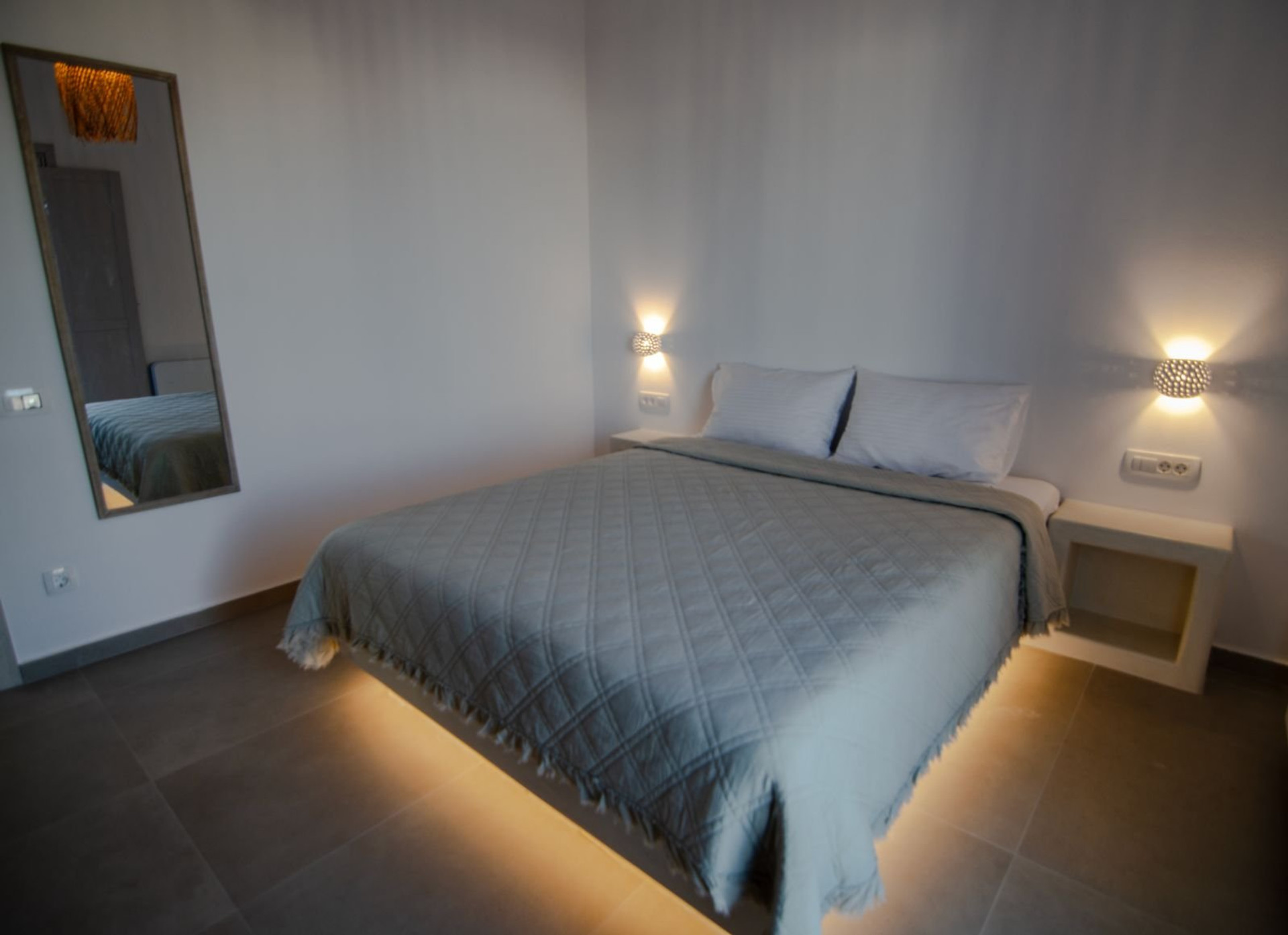 Bedroom with mirror and lighting