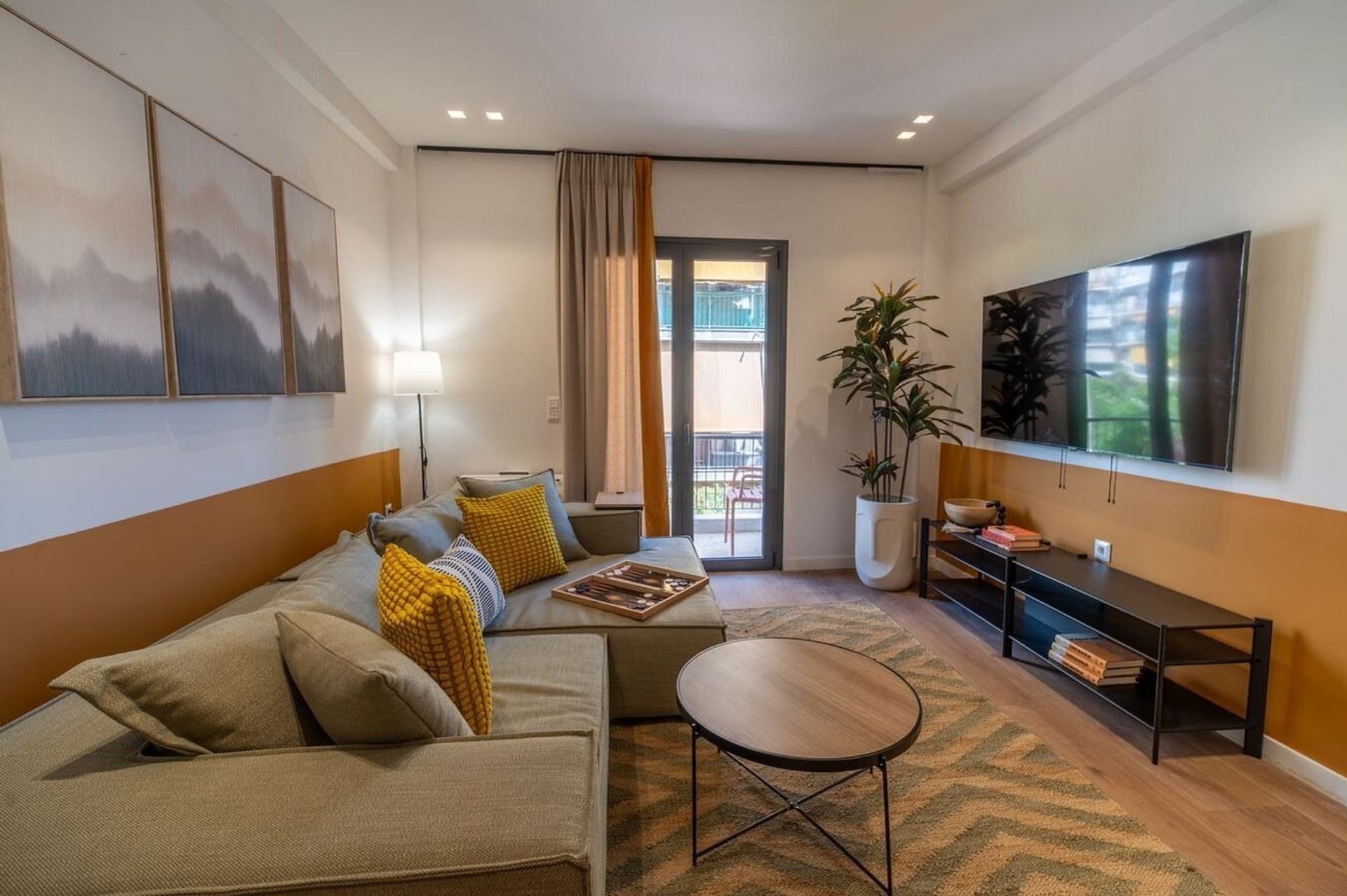 Living room with TV and balcony