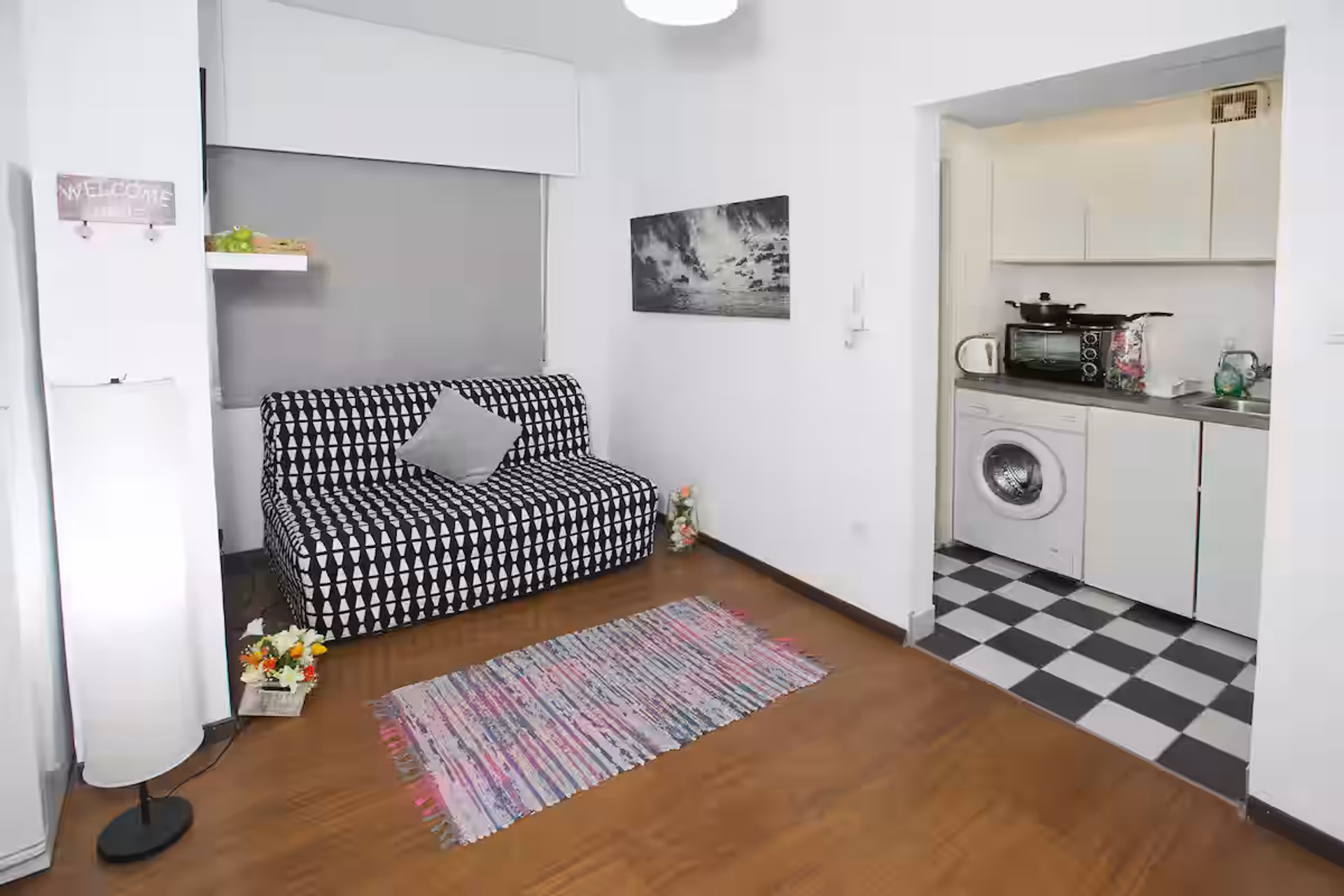 Living area with sofa and kitchen