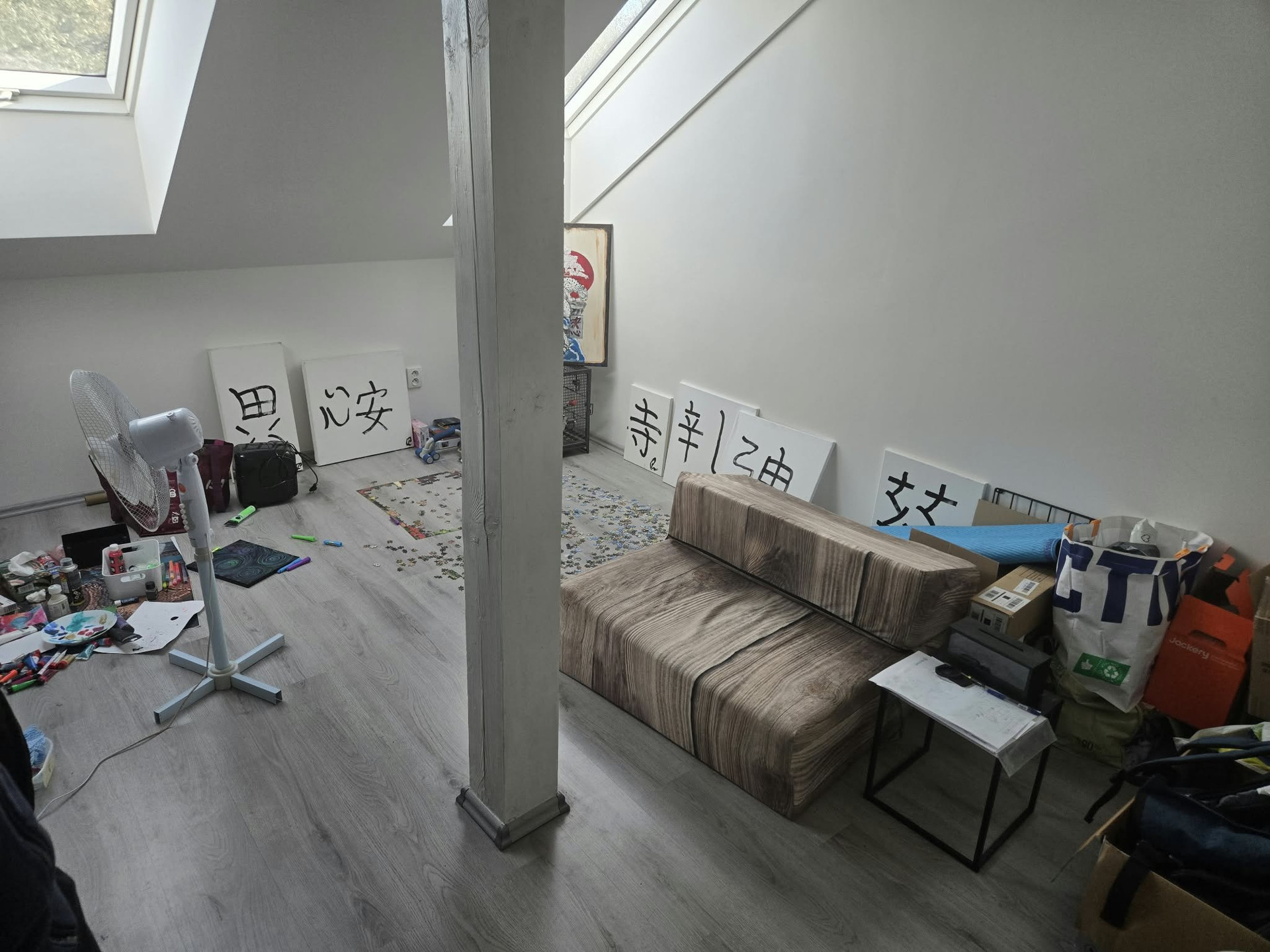 Open attic space with wooden pillar