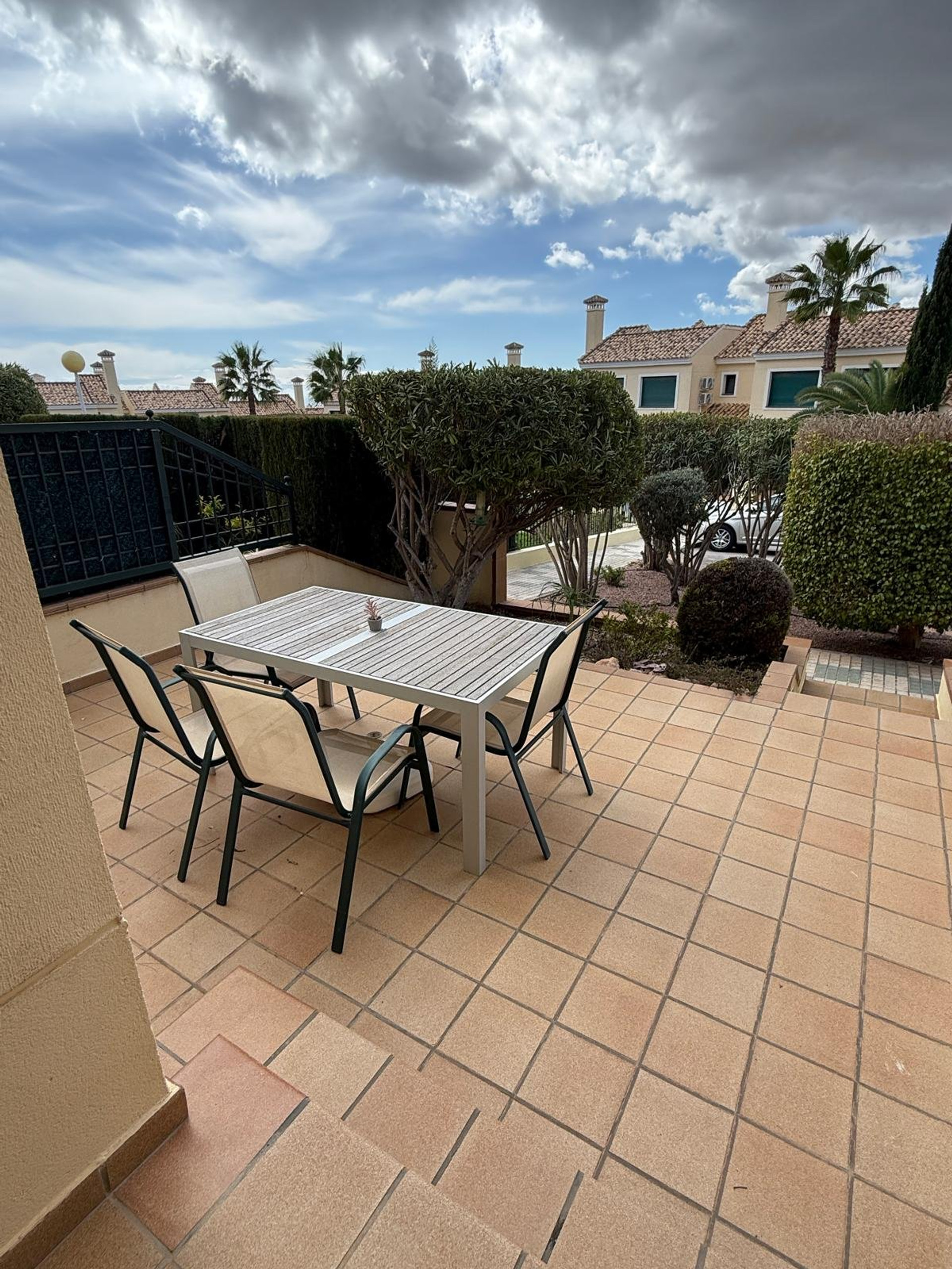 Ground-floor terrace with dining table