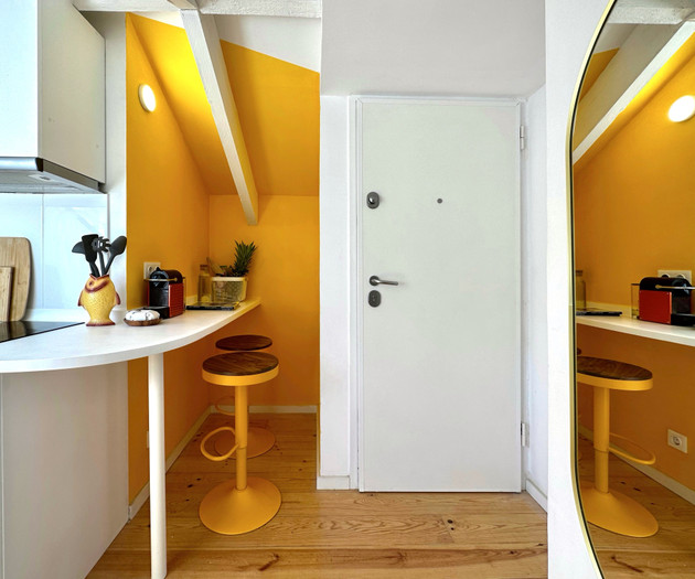 Kitchen entrance with yellow stools