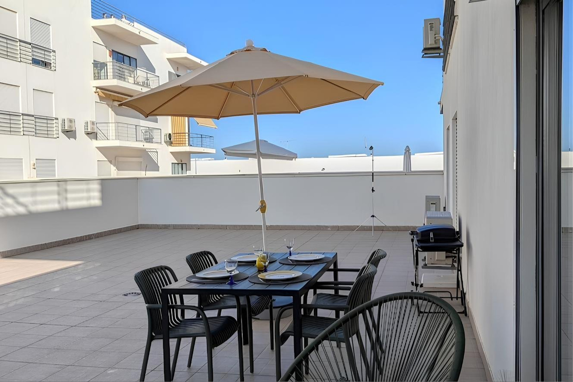 Private Terrace with dining area and BBQ | Enjoy a spacious private terrace with an outdoor dining area, perfect for sunny breakfasts, relaxed lunches, and evening meals under the Algarve sky.