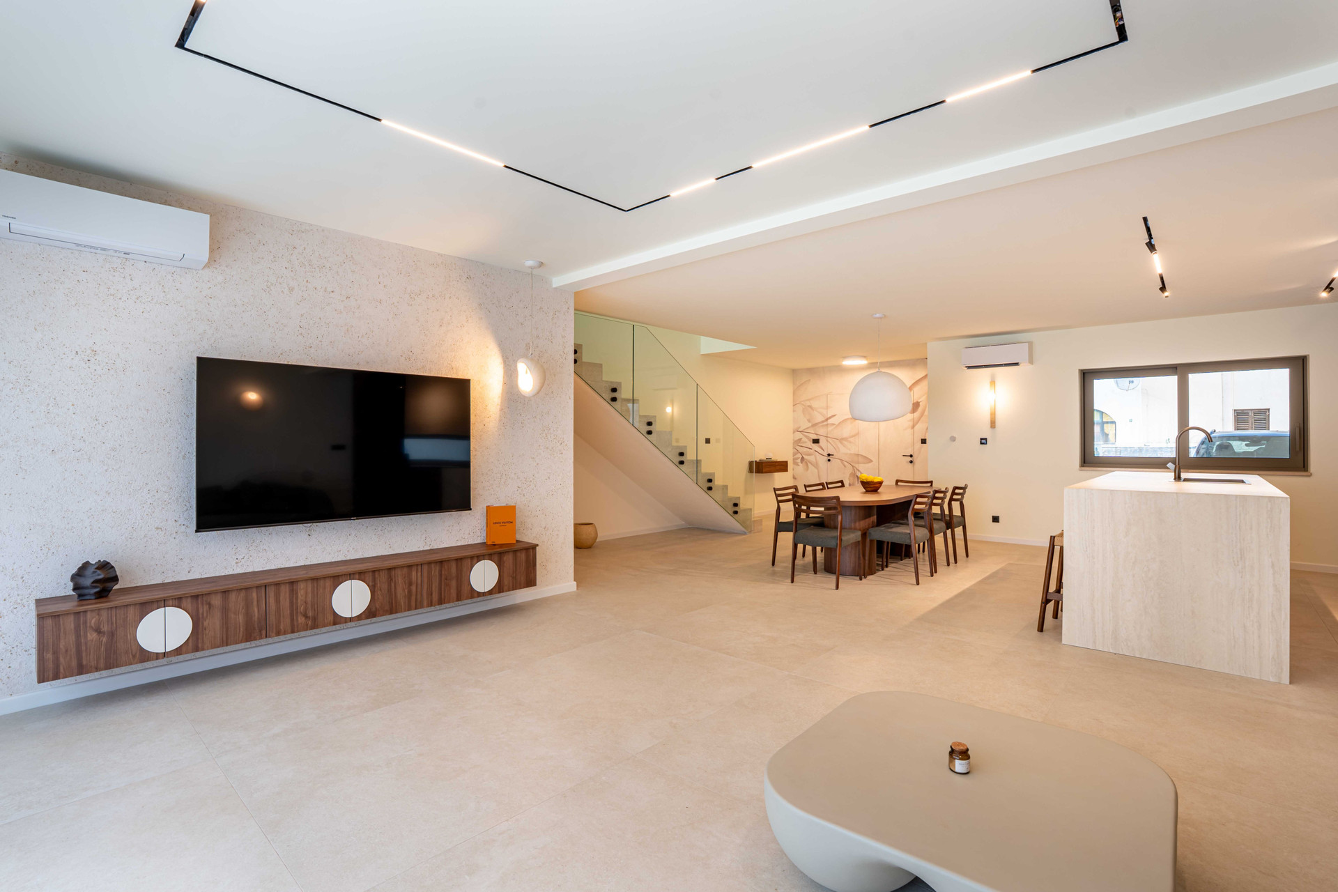 Open-plan living room with TV