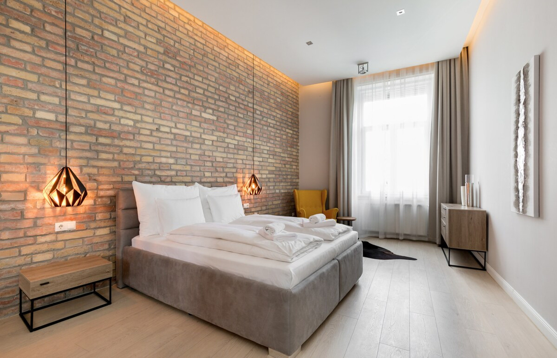 The first bedroom, next to the living room with ample space and nice design (hallmarks of the entire apartment) and an en suite bathroom