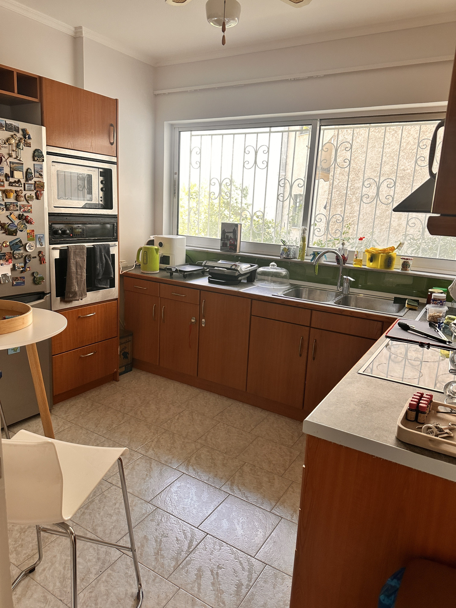 Kitchen with cabinets and window