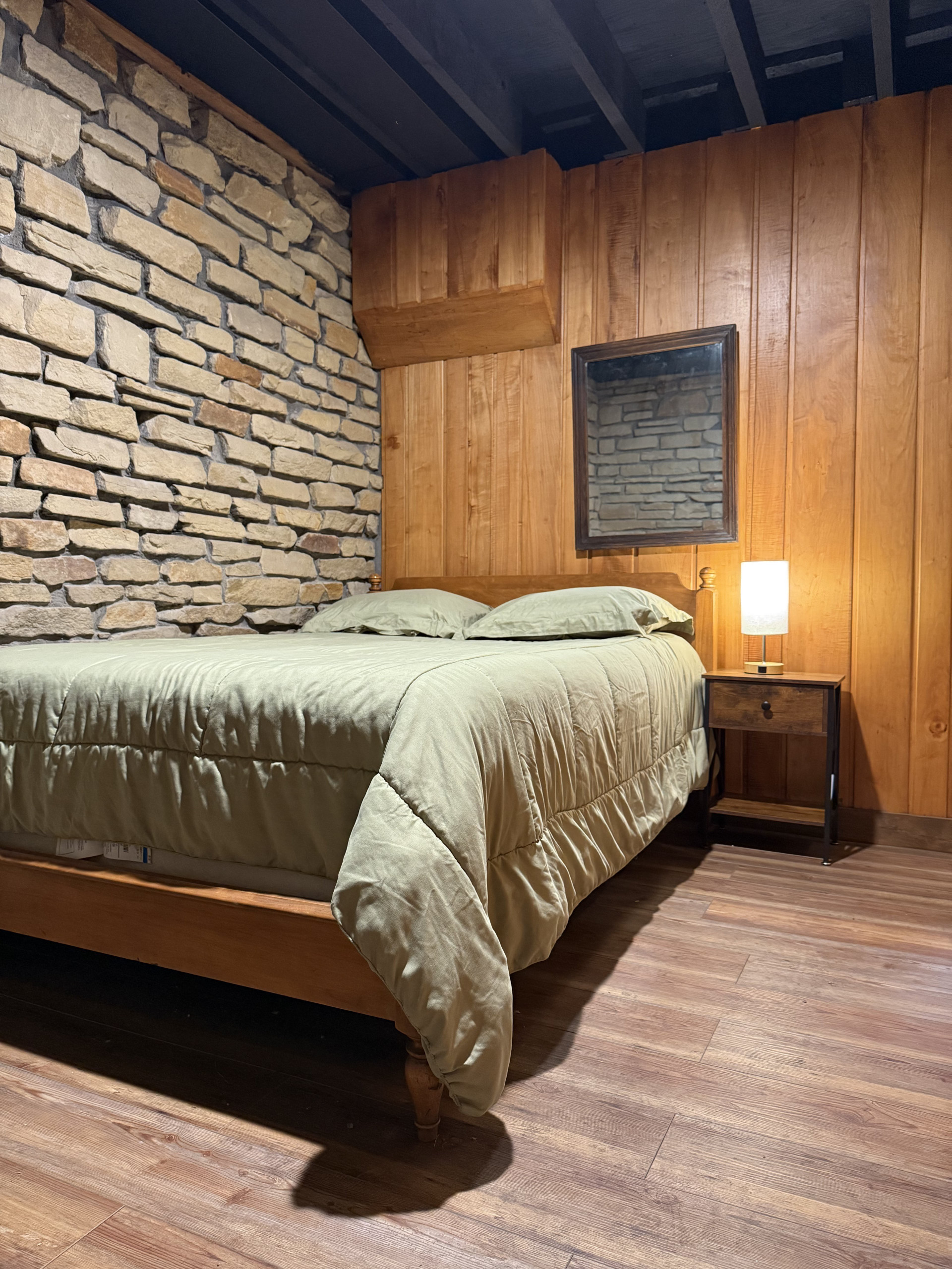 Basement bedroom with wood paneling