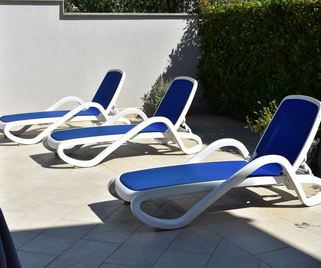 Sun loungers by pool