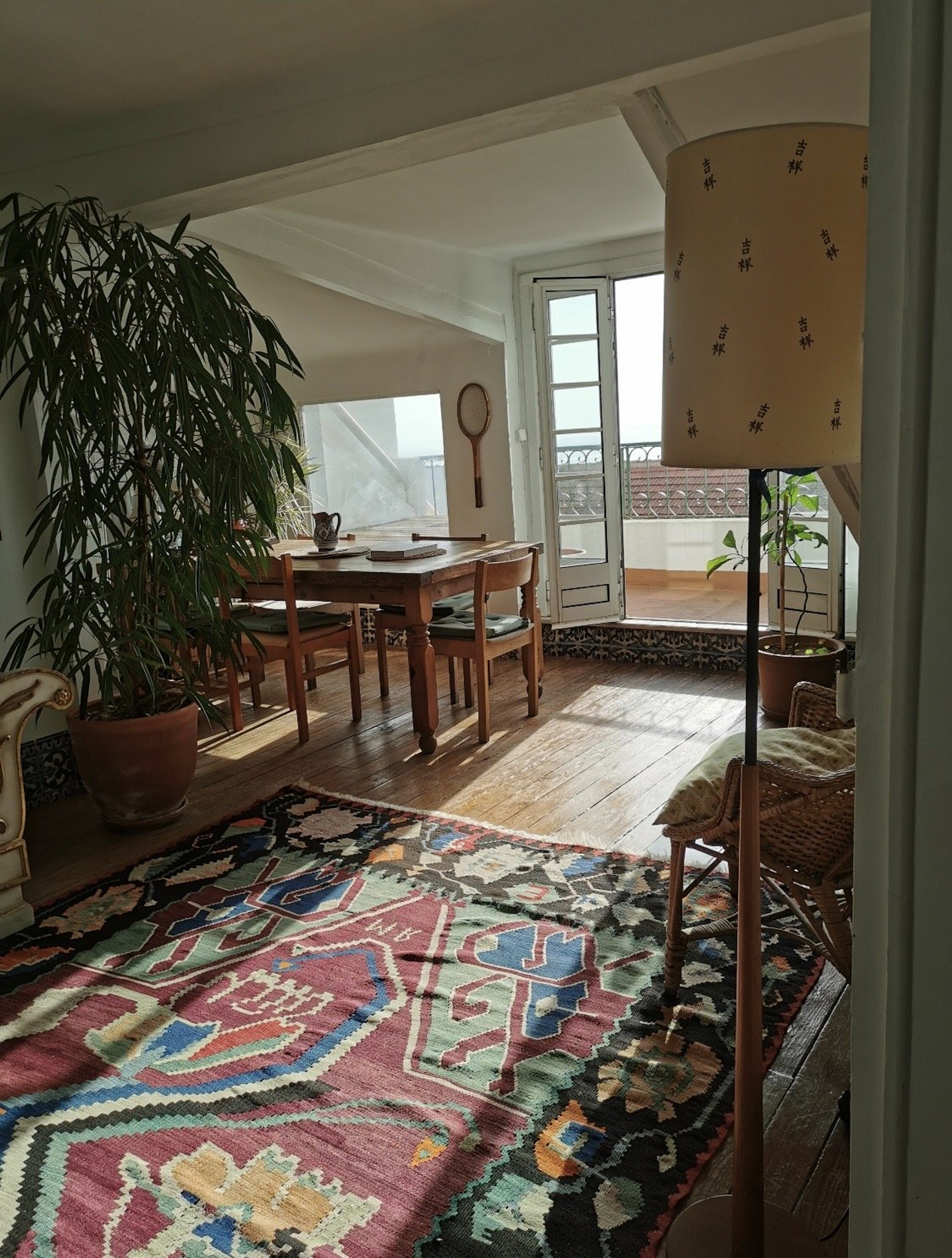 Bright dining room with balcony doors