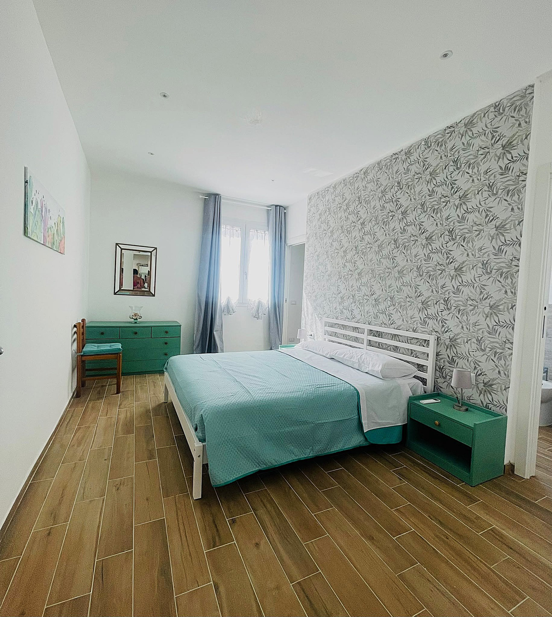 Bedroom with teal accents