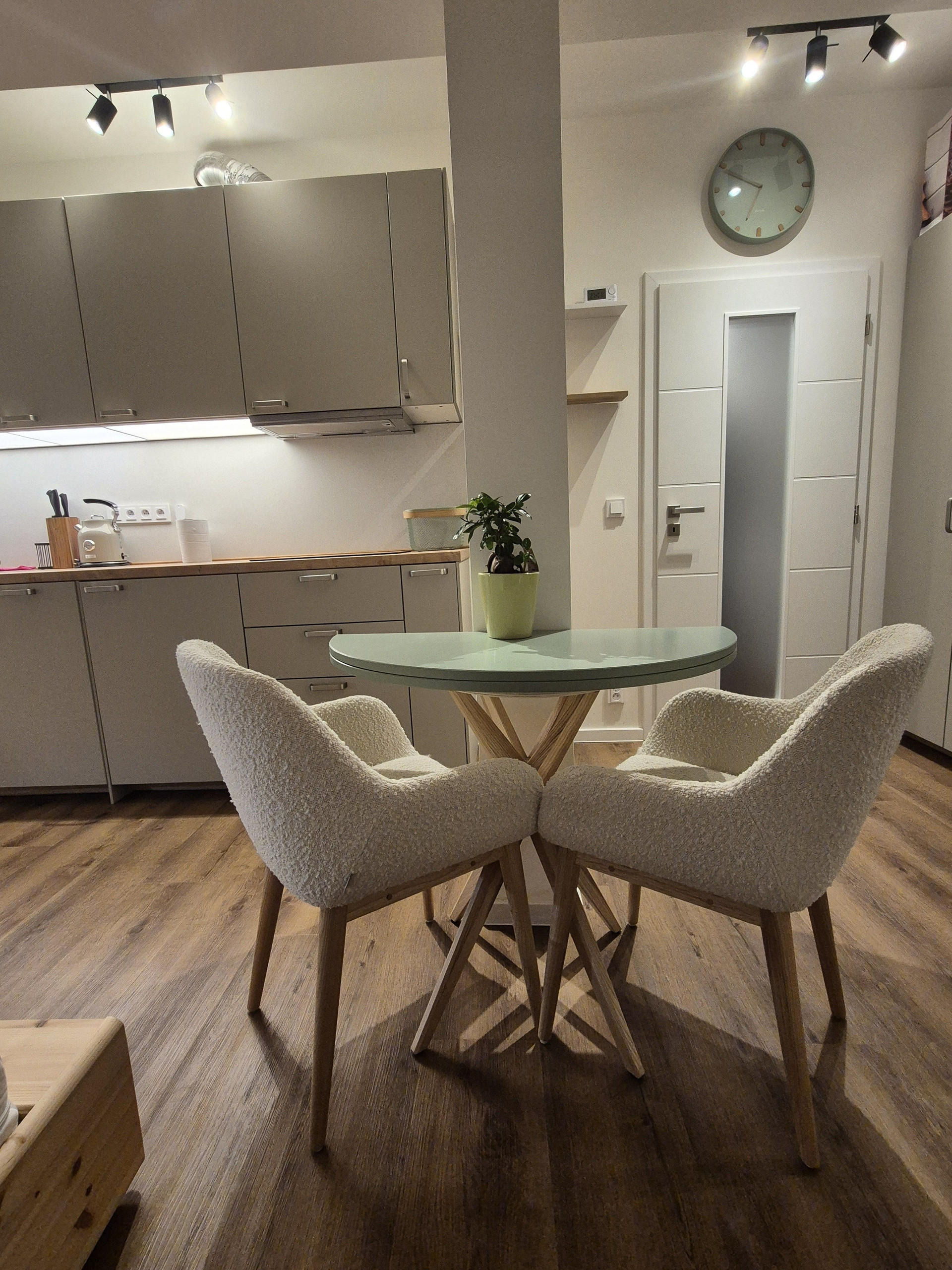 Dining area with kitchen behind
