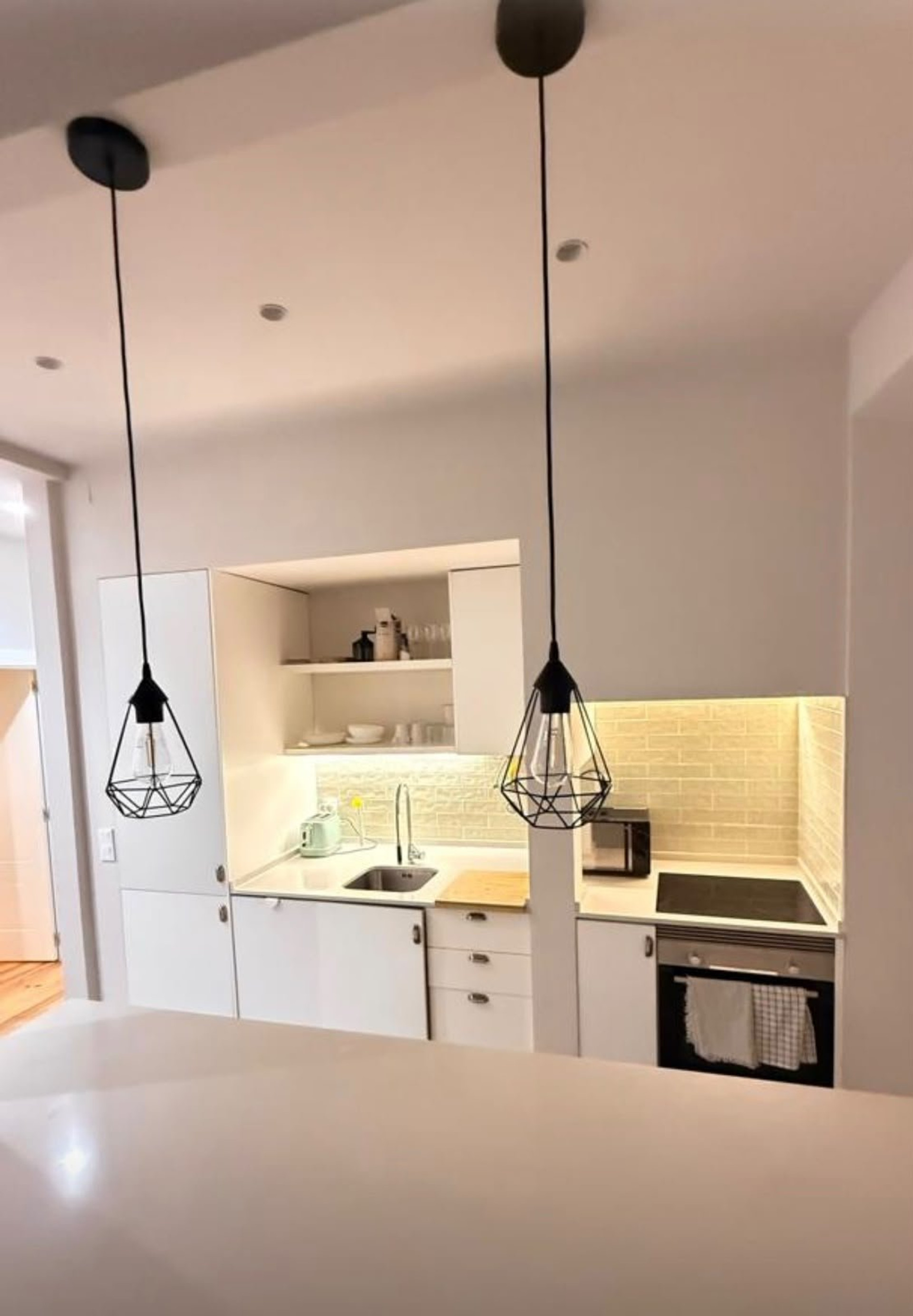 Compact kitchen with pendant lights