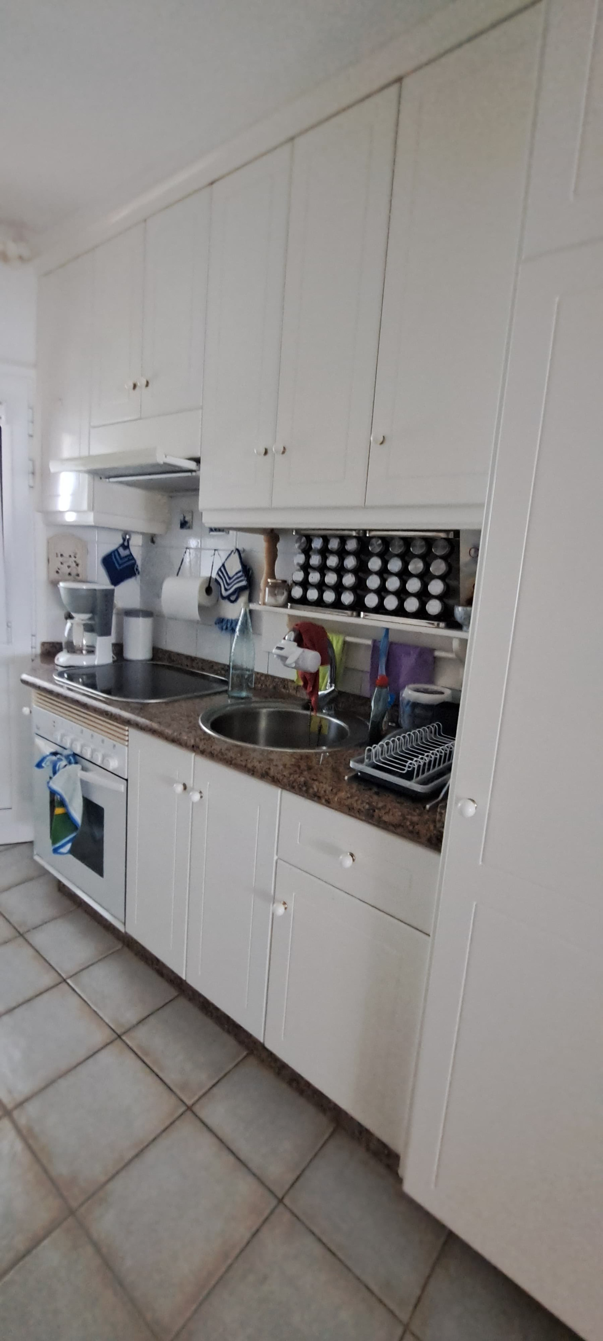 White kitchen with granite counters
