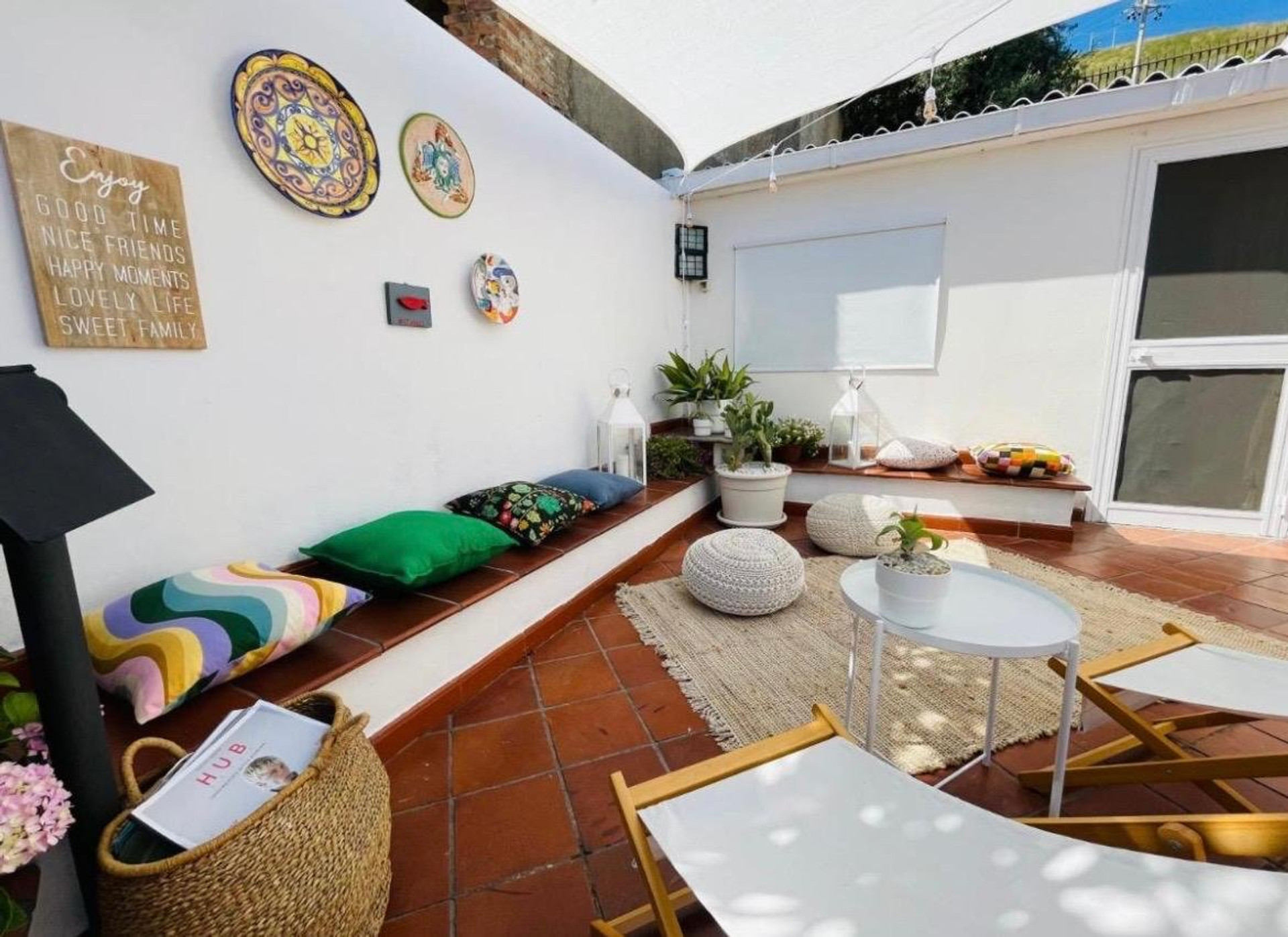 Shaded terrace lounge with cushions