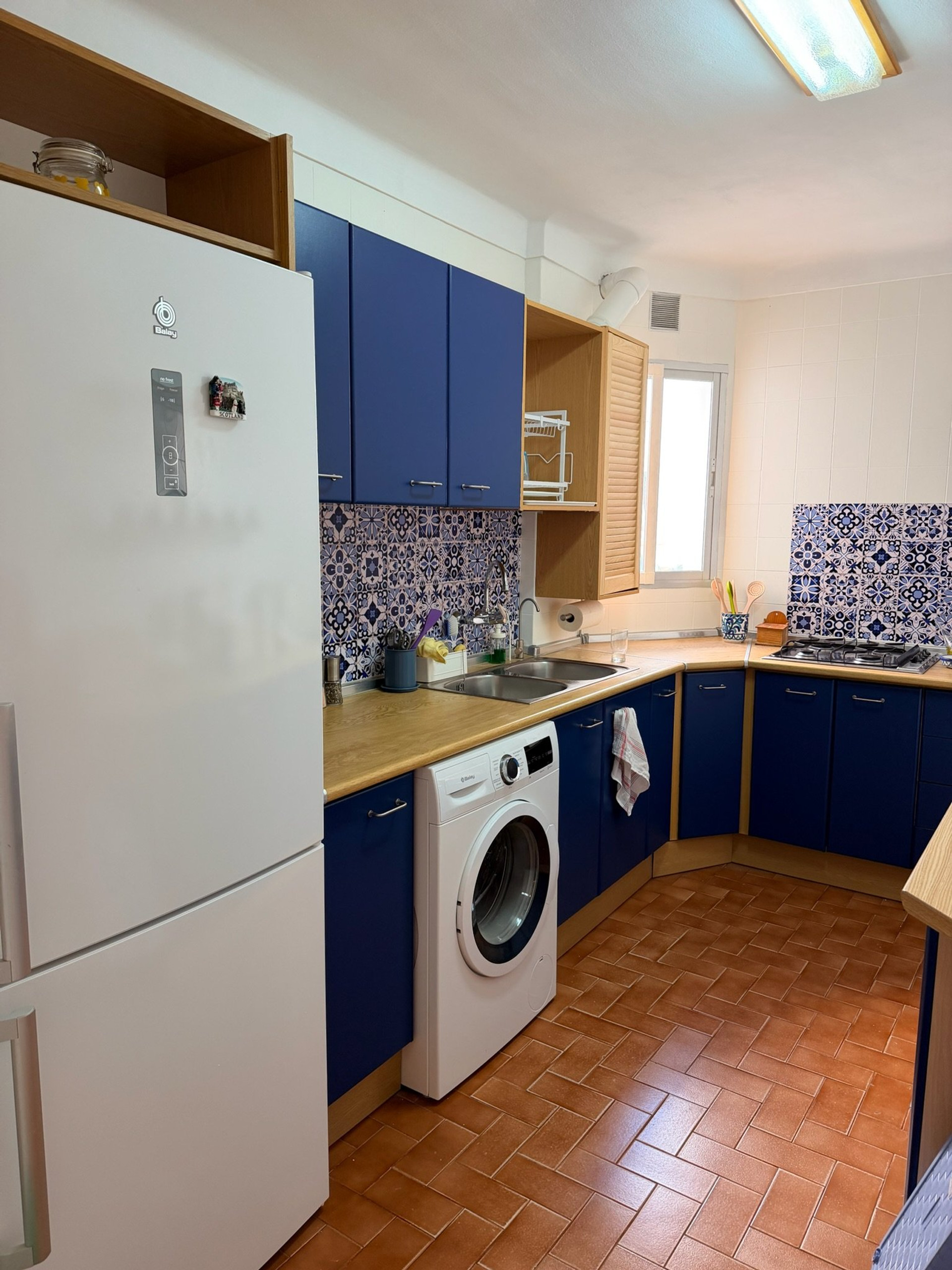 Kitchen with blue cabinets