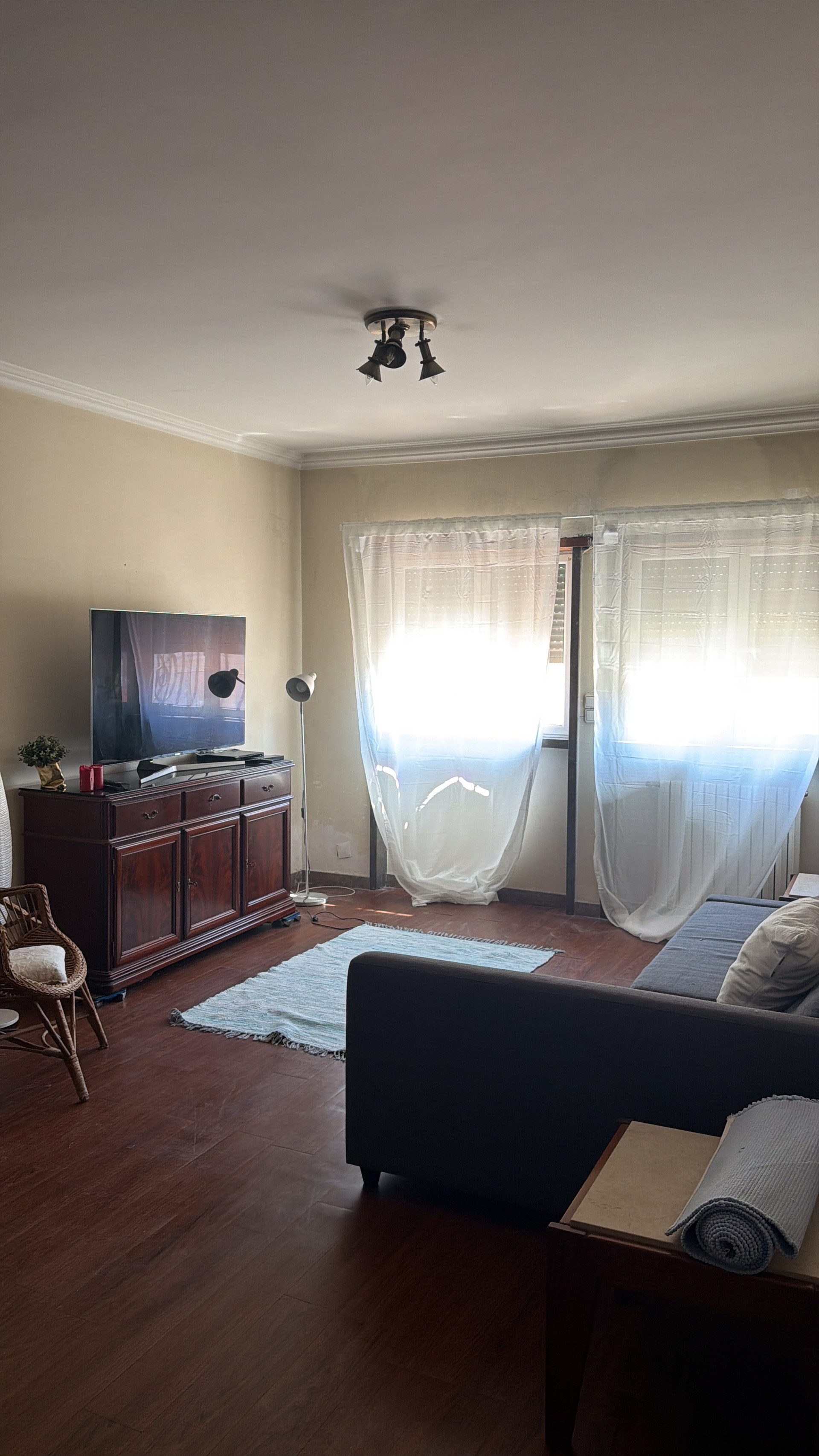 Living area with sheer curtains