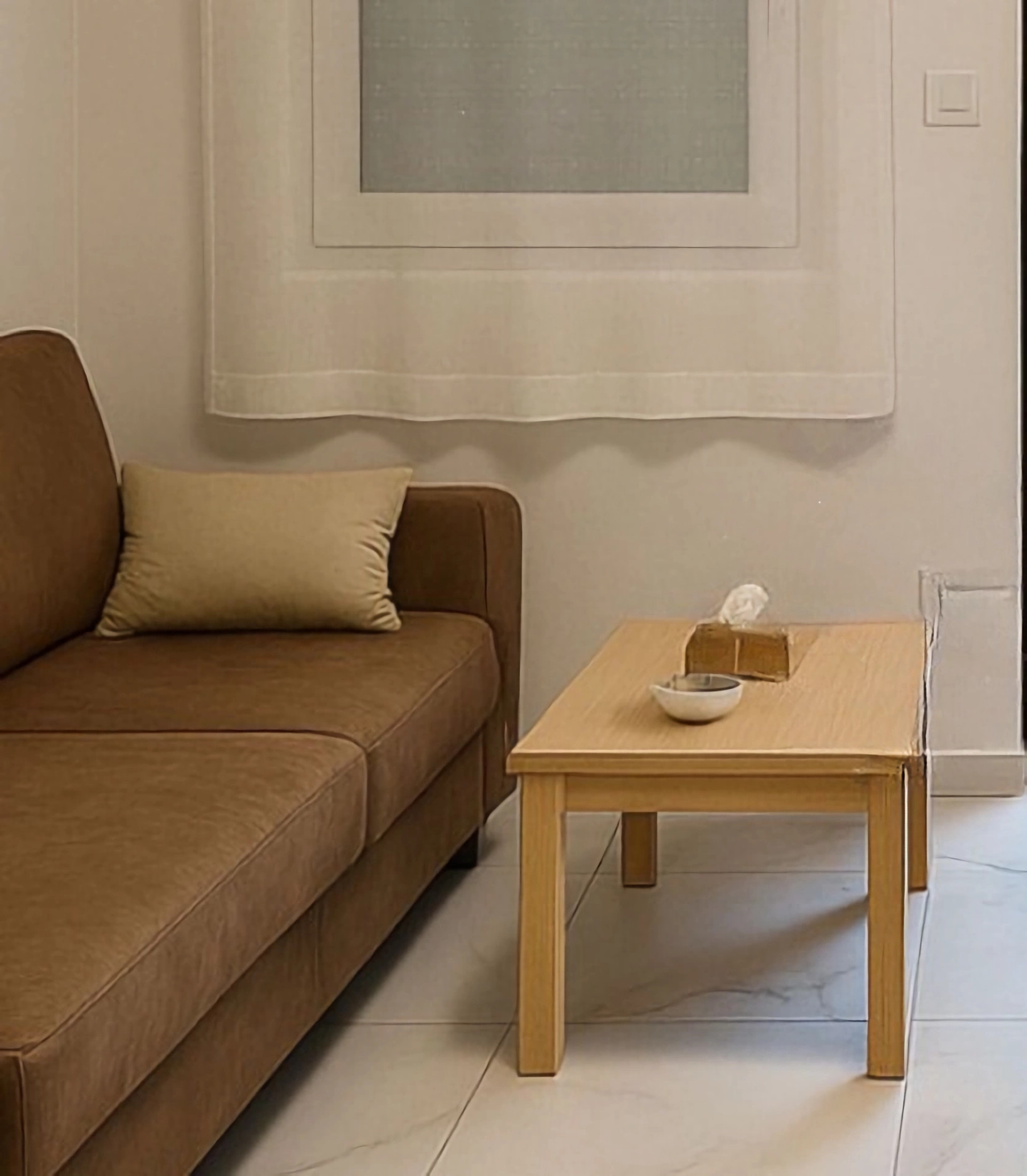 Relaxing living space with a comfortable sofa and warm, modern design